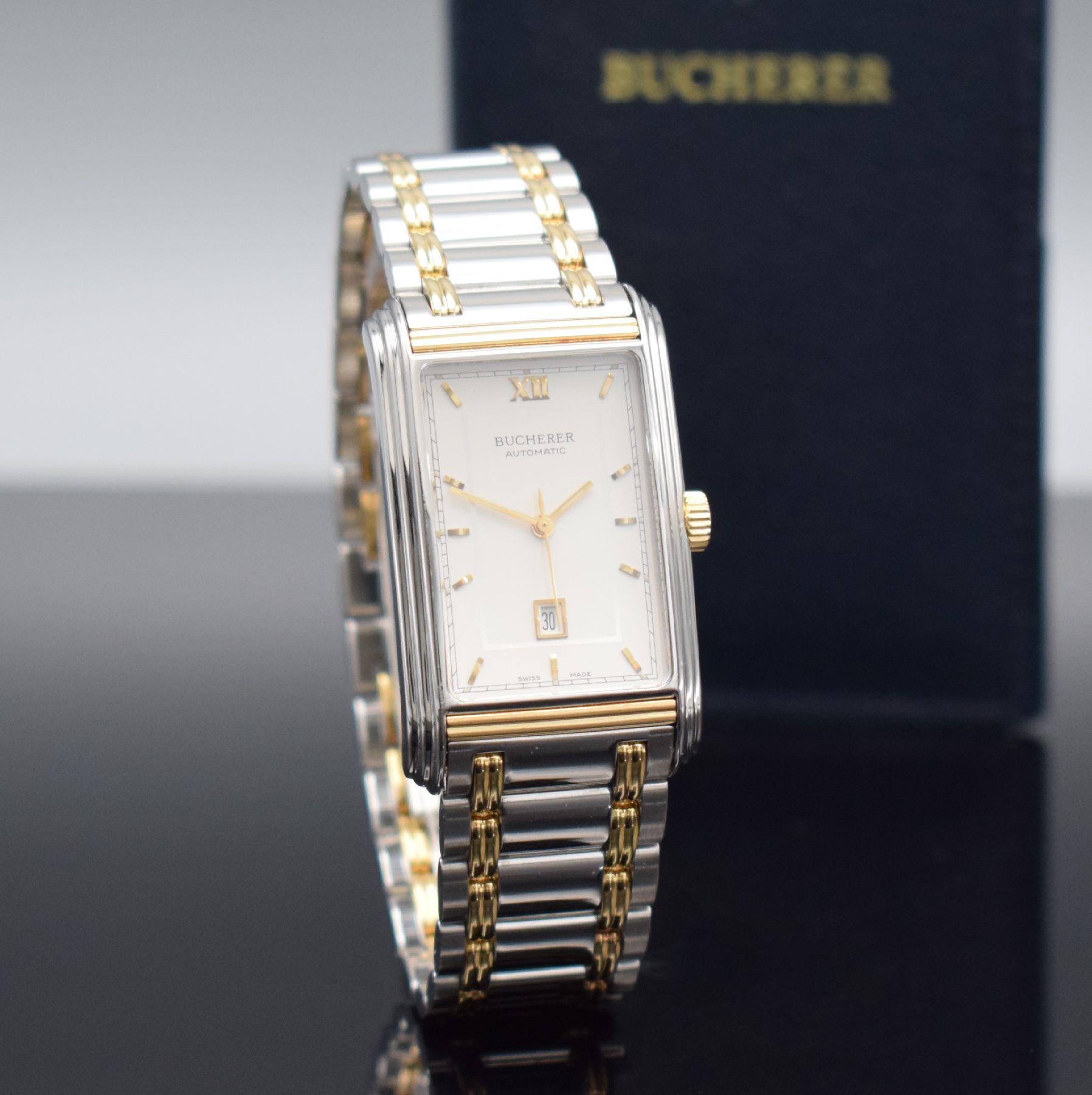 Detail c: BUCHERER rechteckige Herrenarmbanduhr Modell Archimedes in Stahl/Gold, Schweiz verk. lt. beil. Pap. 03/1996, Automatik, Ref. 2000-503, Boden 4-fach ...