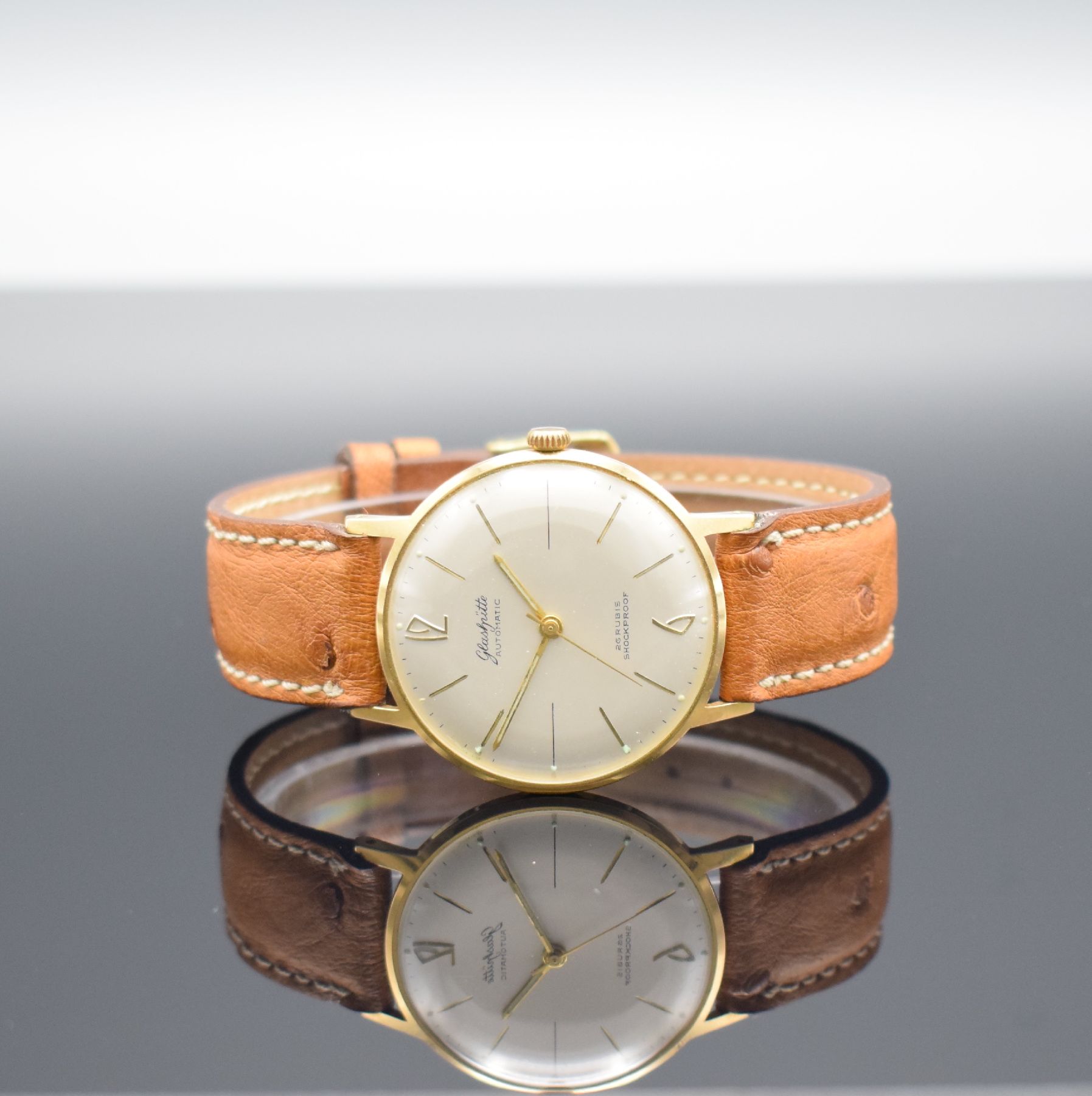 GLASHÜTTE Herrenarmbanduhr, Automatik, Deutschland um 1970, verg. Metallgeh., Edelstahlboden aufgedr., silb. Zifferbl. m. aufgel. gold. Indizes, ...