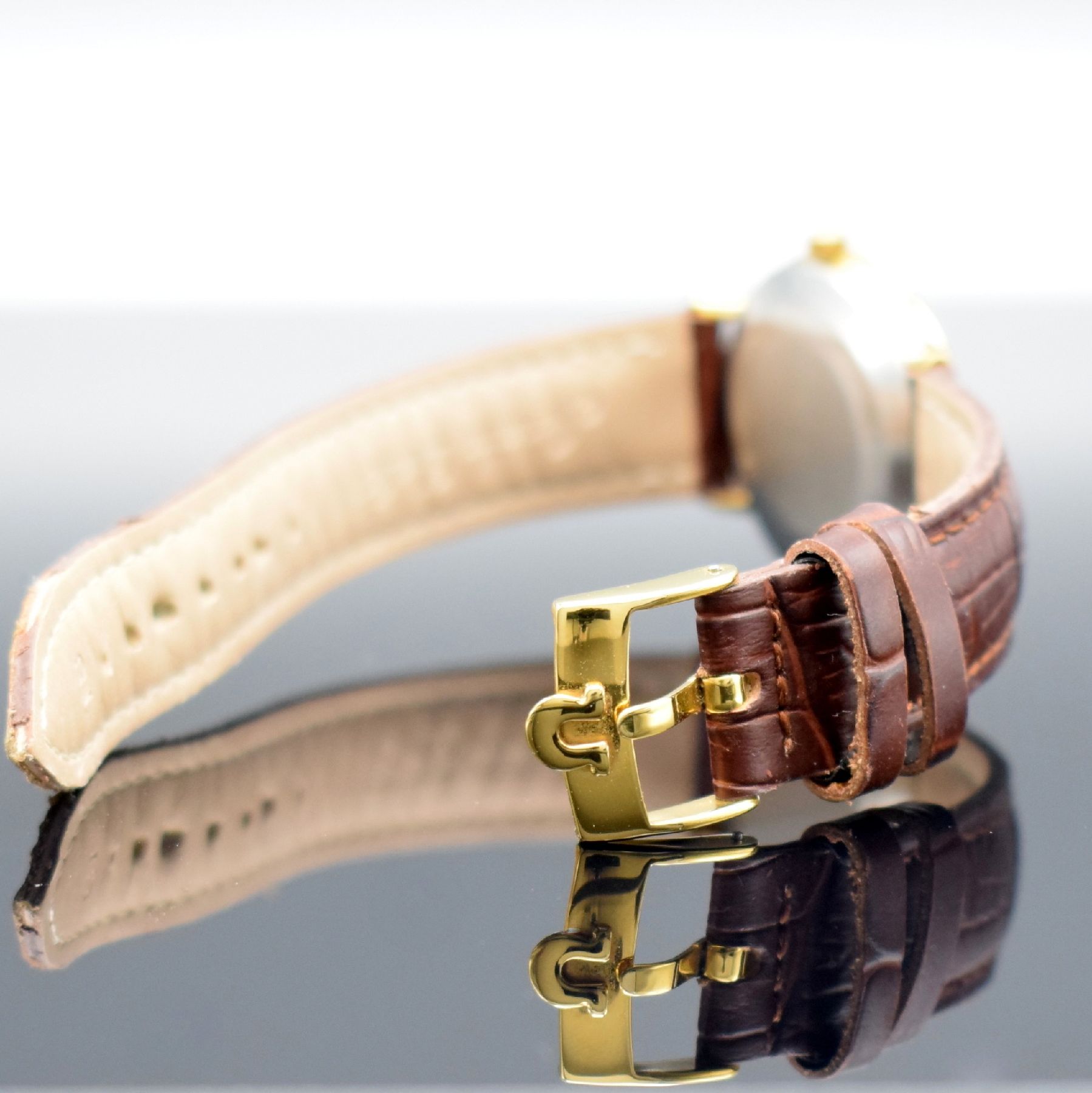 Detail d: OMEGA Herrenarmbanduhr Serie Geneve, Automatik, Schweiz um 1964, verg. Metallgeh., Edelstahlboden aufgedr., Lederband m. verg. orig. Dornschl., orig. ...