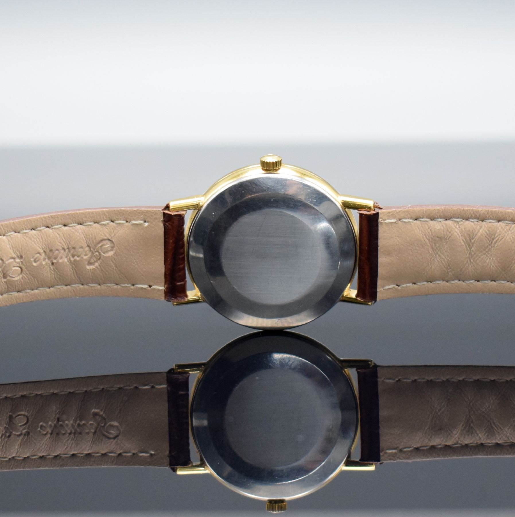 Detail f: OMEGA Herrenarmbanduhr Serie Geneve, Automatik, Schweiz um 1964, verg. Metallgeh., Edelstahlboden aufgedr., Lederband m. verg. orig. Dornschl., orig. ...