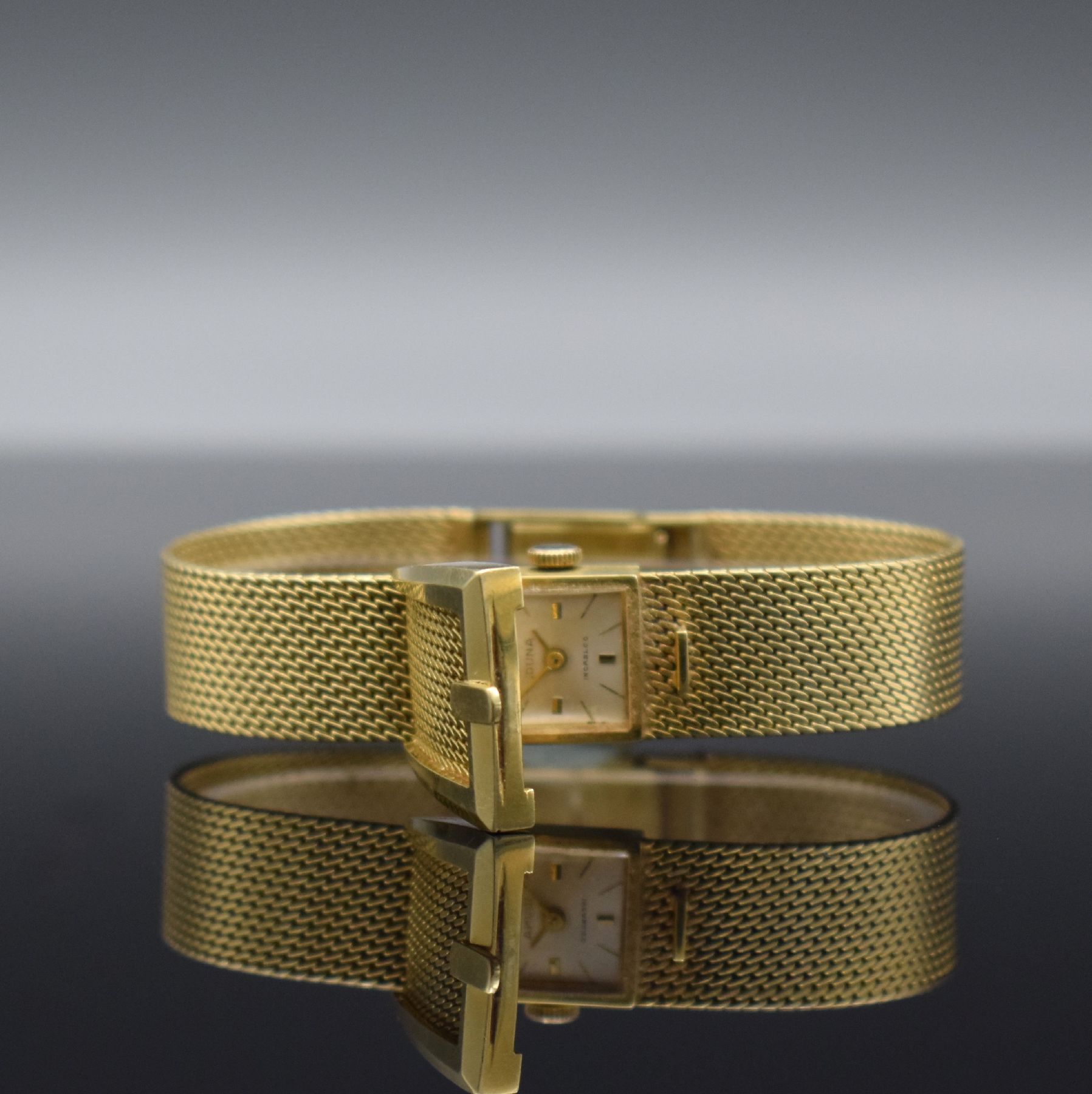 DUNA ausgefallene Damenarmbanduhr in GG 585/000, Schweiz um 1965, Handaufzug, 2- teil. Gehäuse, Boden aufgedr., Milanaiseband, stilis. Klappdeckel ...