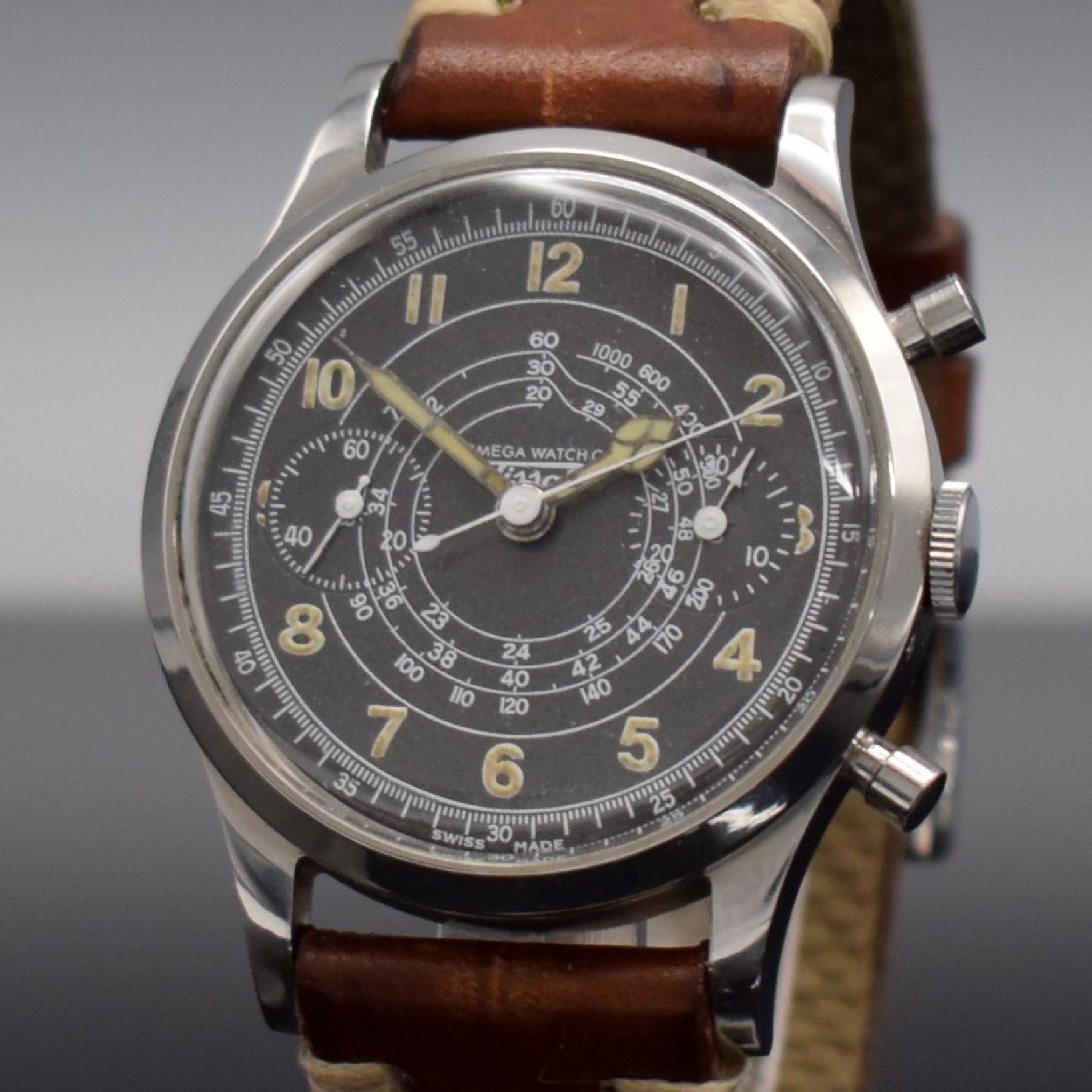 Detail c: TISSOT Schaltradchronograph Kaliber Lemania 15TL, Handaufzug, Schweiz um 1950, späteres Stahlgeh. m. gedr. orig. Boden, graues Zifferbl. rest., ...