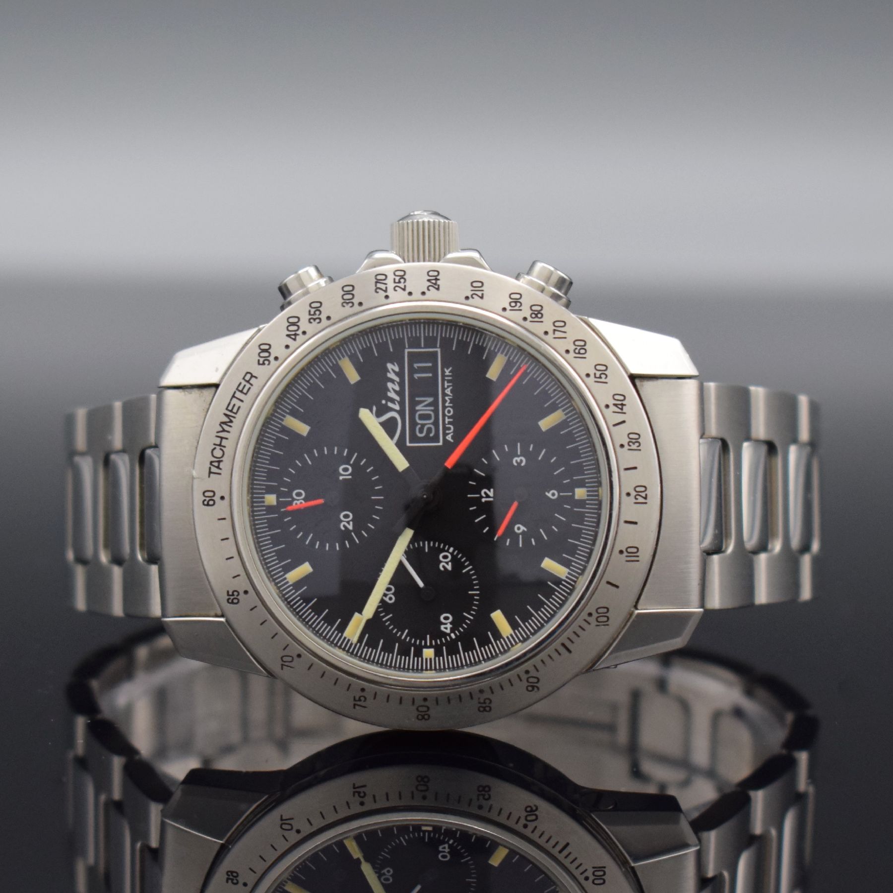 SINN Herrenarmbanduhr mit Chronograph, Deutschland um 1995, Automatik, Ref. 303, verschr. Edelstahlgeh. inkl. orig. Gliederband m. Faltschl., ...