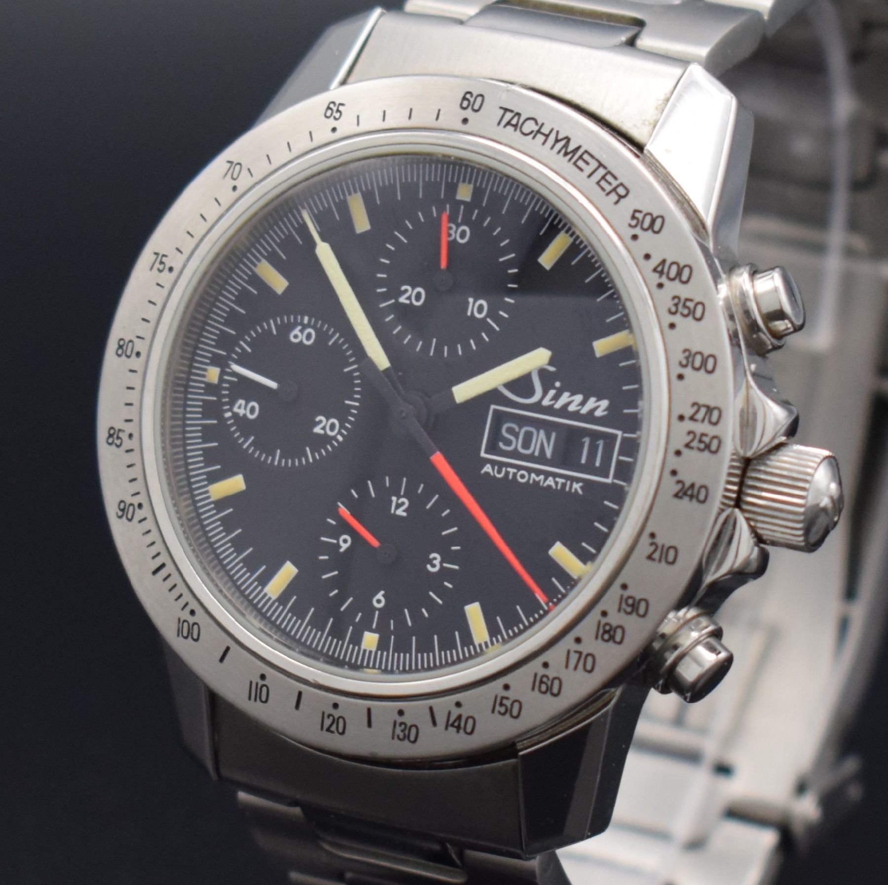 Detail c: SINN Herrenarmbanduhr mit Chronograph, Deutschland um 1995, Automatik, Ref. 303, verschr. Edelstahlgeh. inkl. orig. Gliederband m. Faltschl., ...