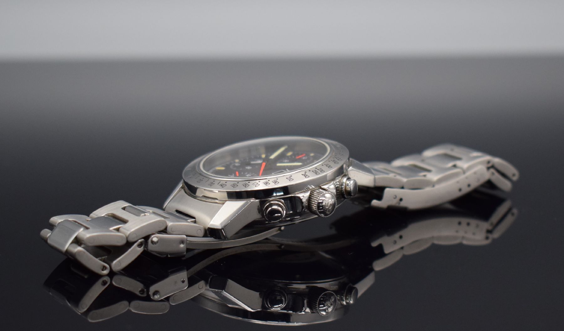 Detail e: SINN Herrenarmbanduhr mit Chronograph, Deutschland um 1995, Automatik, Ref. 303, verschr. Edelstahlgeh. inkl. orig. Gliederband m. Faltschl., ...