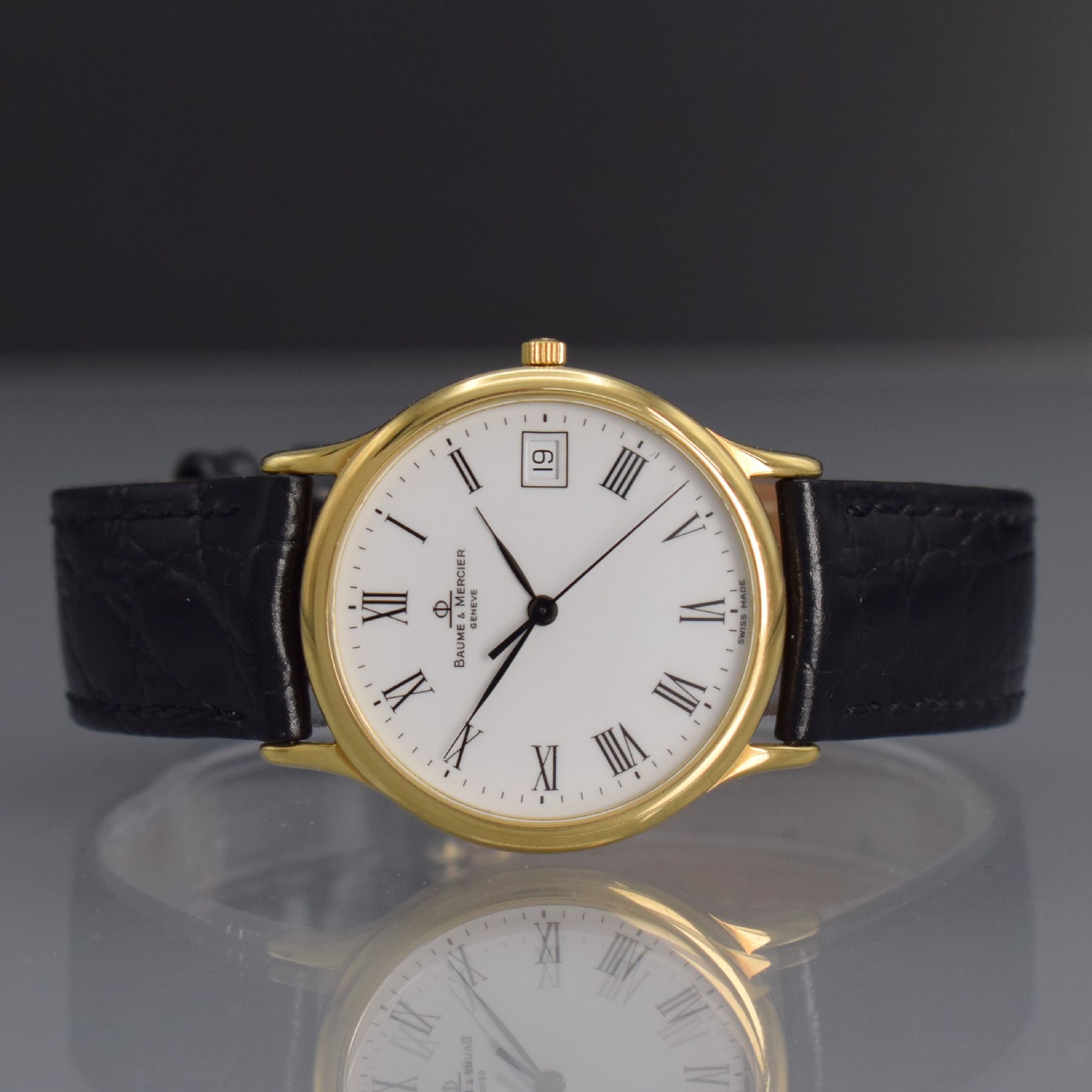 BAUME & MERCIER Armbanduhr in GG 750/000, Schweiz um 1995, quarz, 2-teil. Geh., Boden aufgedr., weißes Zifferbl. m. röm. Zahlen, schwarze Zeiger, ...