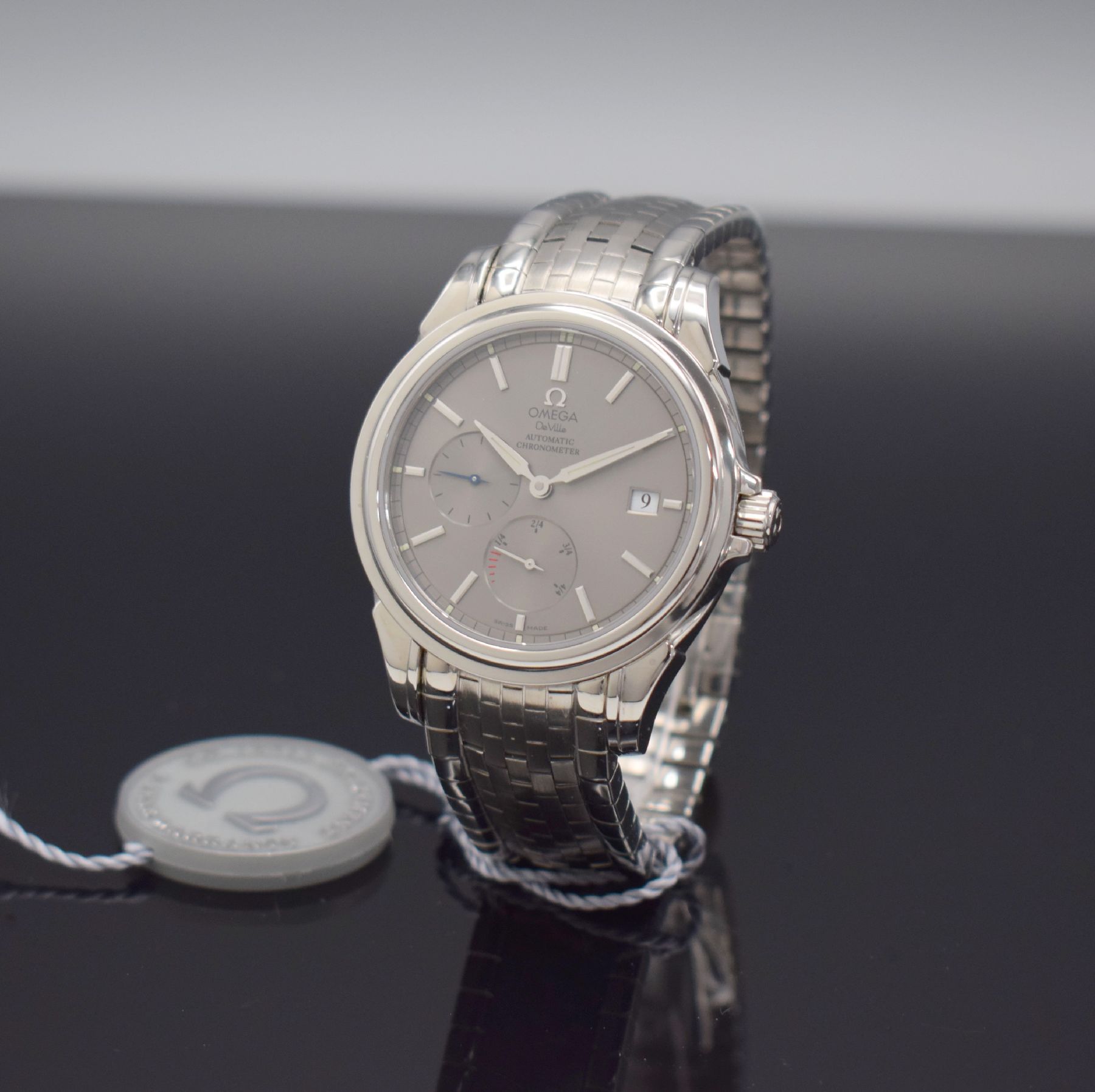 Detail b: OMEGA Herrenarmbanduhr De Ville Co-Axial Power Reserve, Automatik, Schweiz um 2002, Ref. 168.1704, Chronometer in Edelstahl inkl. orig. Gliederband ...