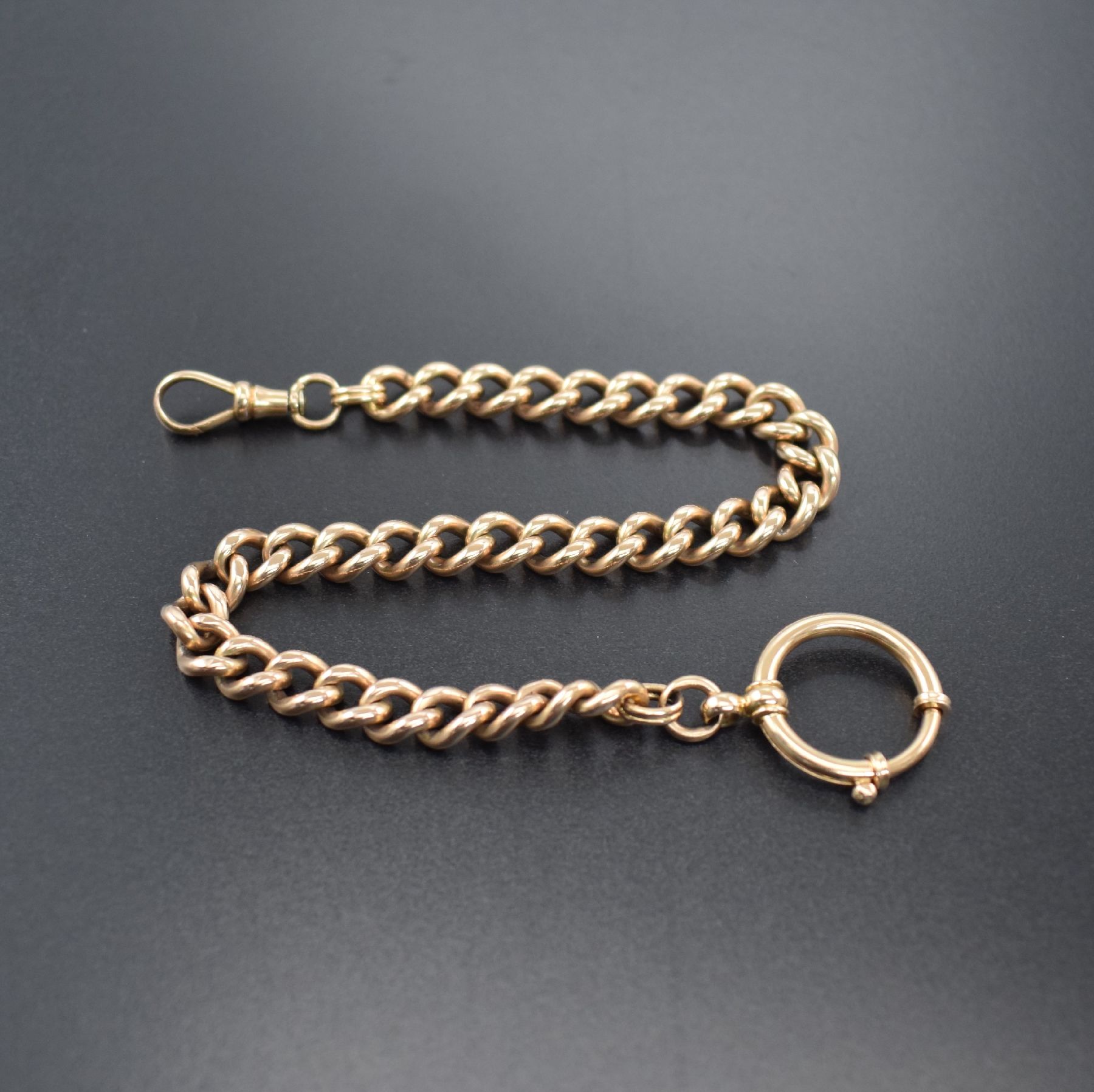 Taschenuhrkette in RG 585/000, Deutschland um 1900, mit Federring & Karabiner, massive Ausführung, L. ca. 26,5 cm, Gew. ca. 42g, Nutzsp., verwendb.