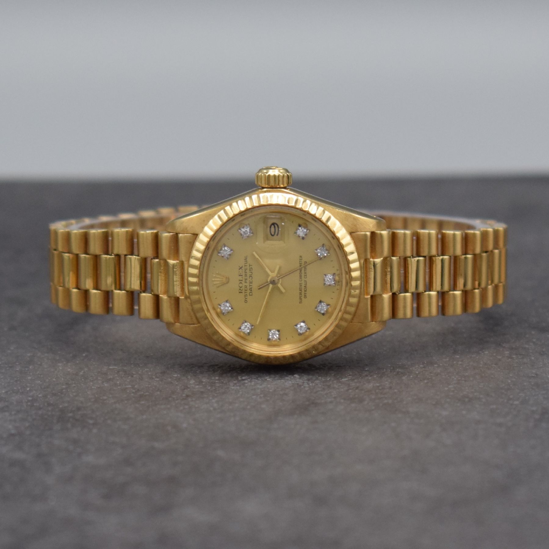 ROLEX Datejust Damenarmbanduhr in GG 750/000, Schweiz um 1980, Automatik, Ref. 6917, verschr. Oystergehäuse inkl. Presidentband m. Faltschl., gold. ...