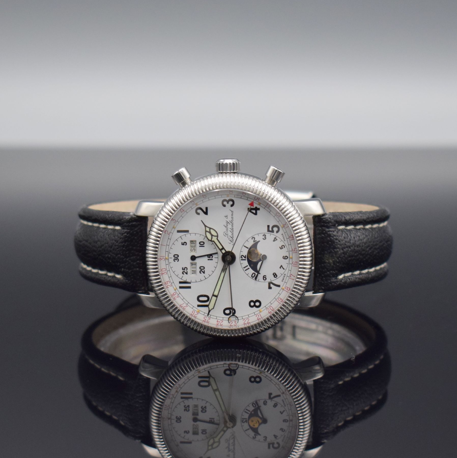 DUBEY & SCHALDENBRAND Armbandchronograph mit Vollkalender in Stahl, Schweiz um 1995, Automatik, beids. vergl. Geh. m. Riffel- Lünette, weißes ...