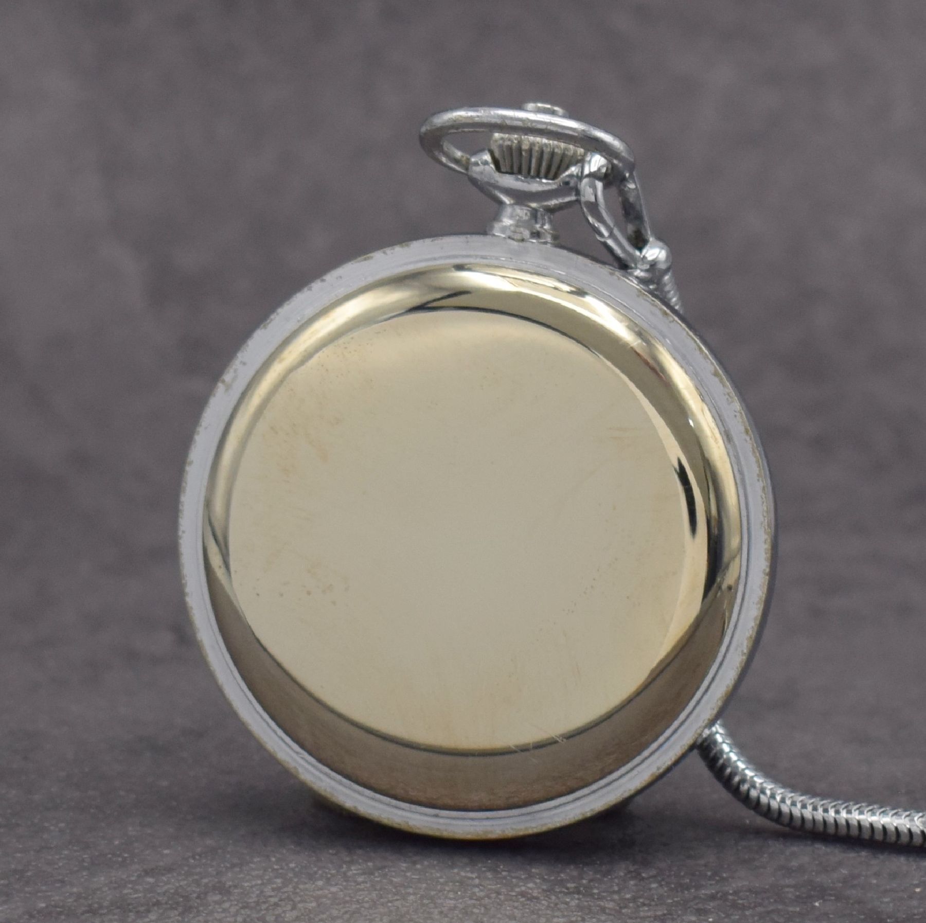 Detail c: SINN Taschenuhr mit Chronograph, Schweiz/ Deutschland um 1960, 3-teil. verchr. Gehäuse, Boden & Glasrand aufgedr., schwarzes Zifferbl. m. arab. ...