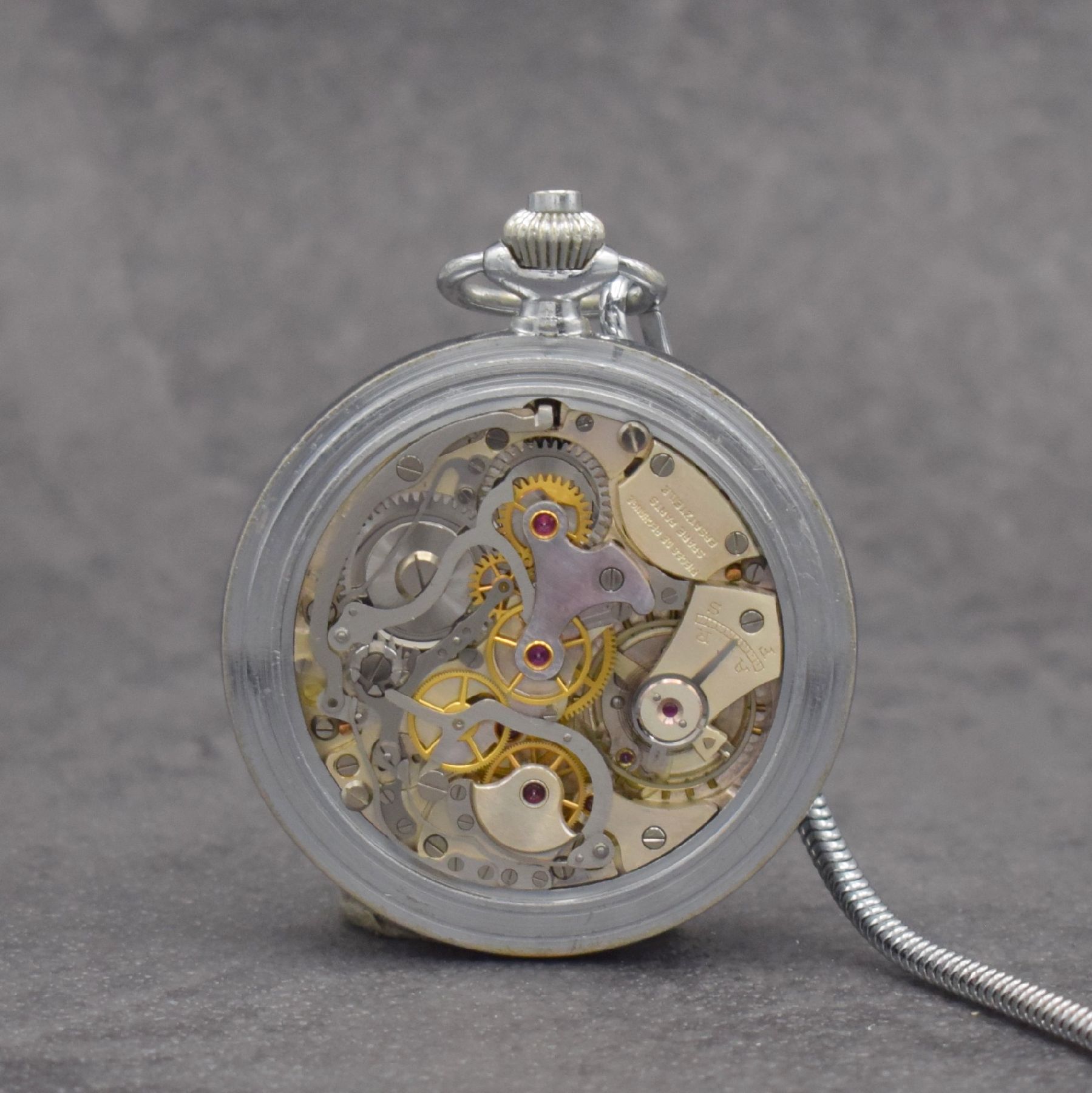 Detail d: SINN Taschenuhr mit Chronograph, Schweiz/ Deutschland um 1960, 3-teil. verchr. Gehäuse, Boden & Glasrand aufgedr., schwarzes Zifferbl. m. arab. ...