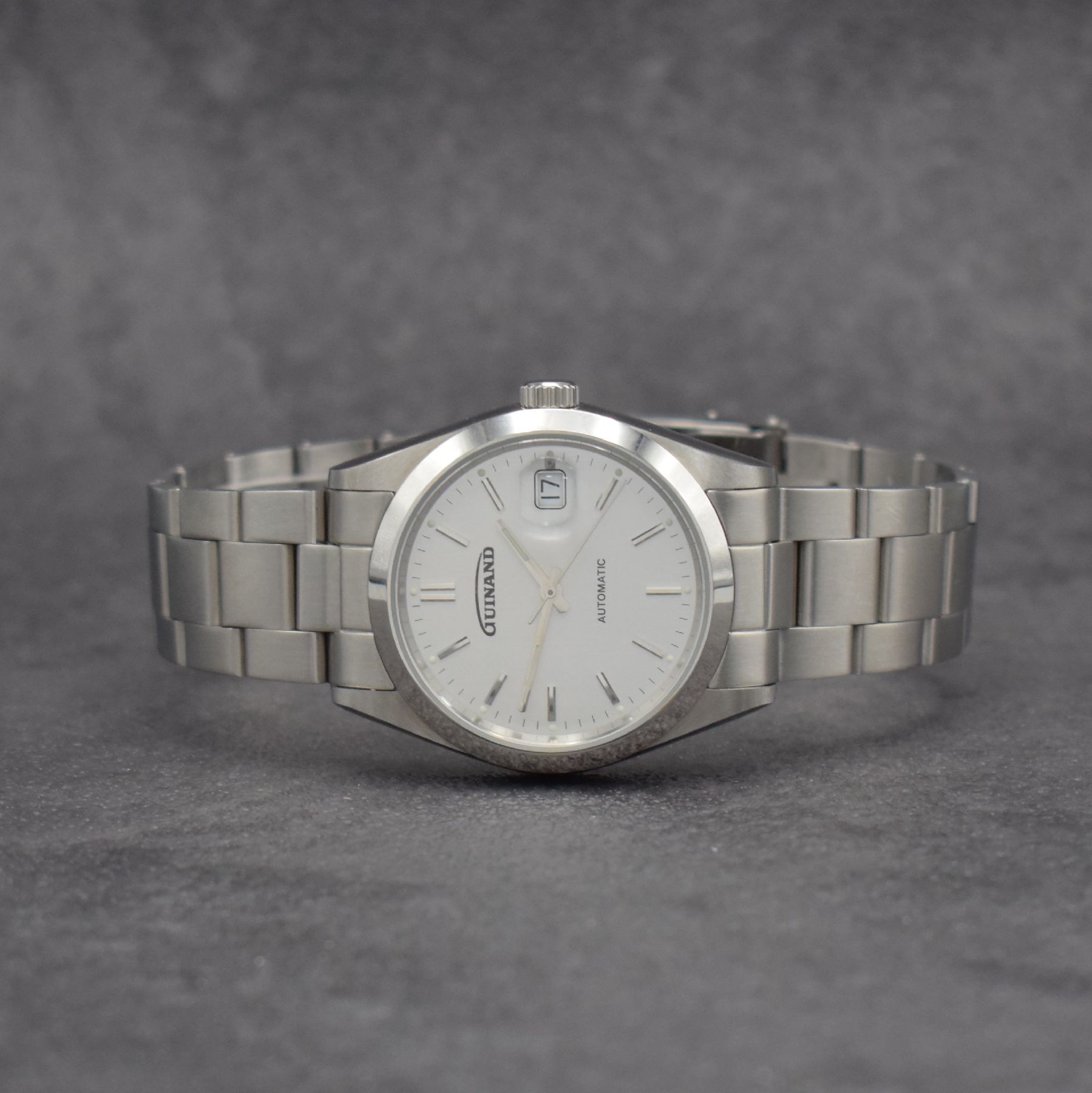 GUINAND Herrenarmbanduhr in Edelstahl, Schweiz um 2014, Ref. G-2402, Automatik, verschr. Gehäuse inkl. neutr. Gliederband m. Faltschl., silb. ...