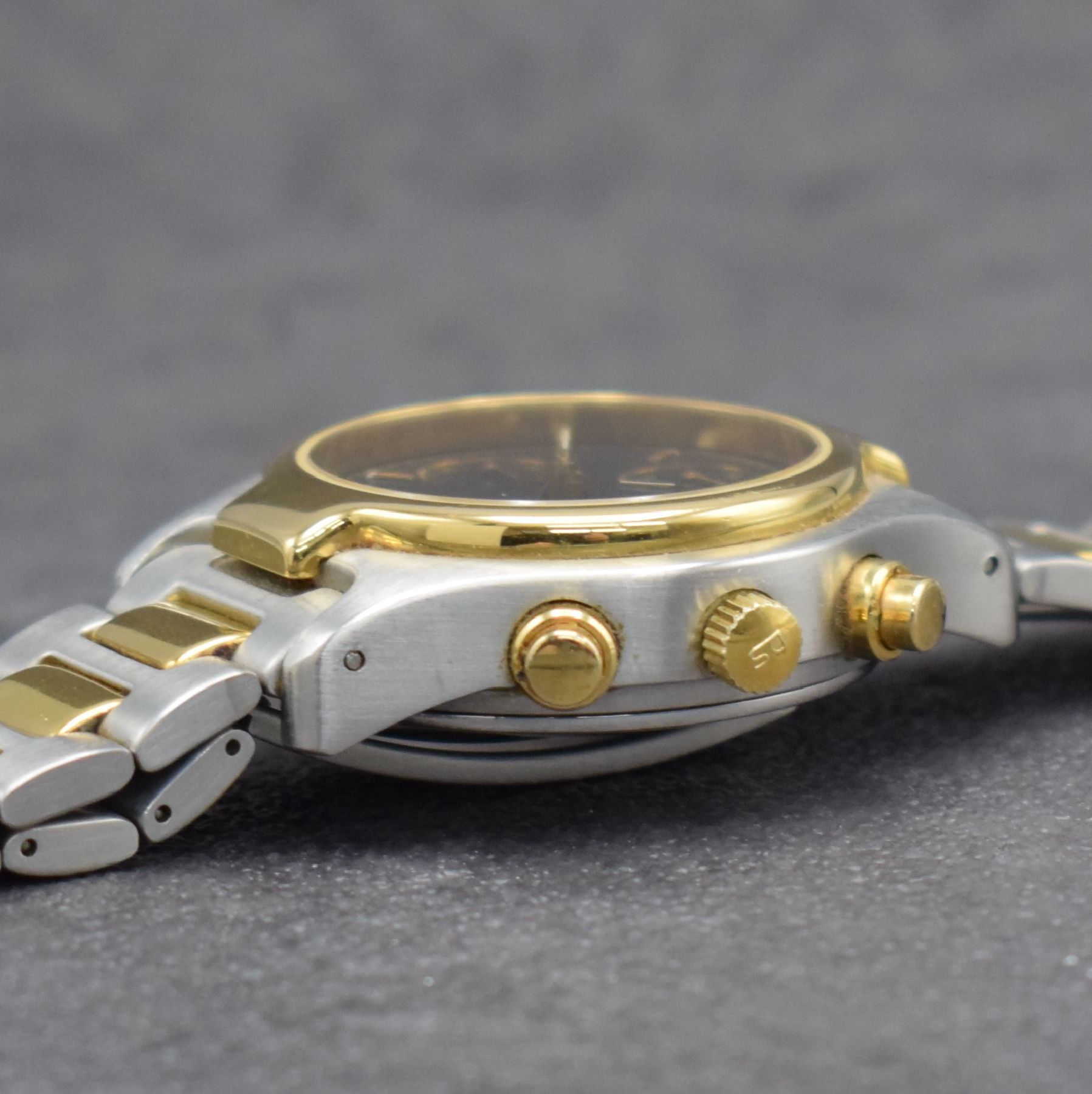 Detail e: CERTINA DS Herrenarmbanduhr mit Chronograph, Schweiz um 1990, Automatik, z. T. verg. Stahlgeh. inkl. Gliederband m. Faltschl., schwarzes Zifferbl. m. ...