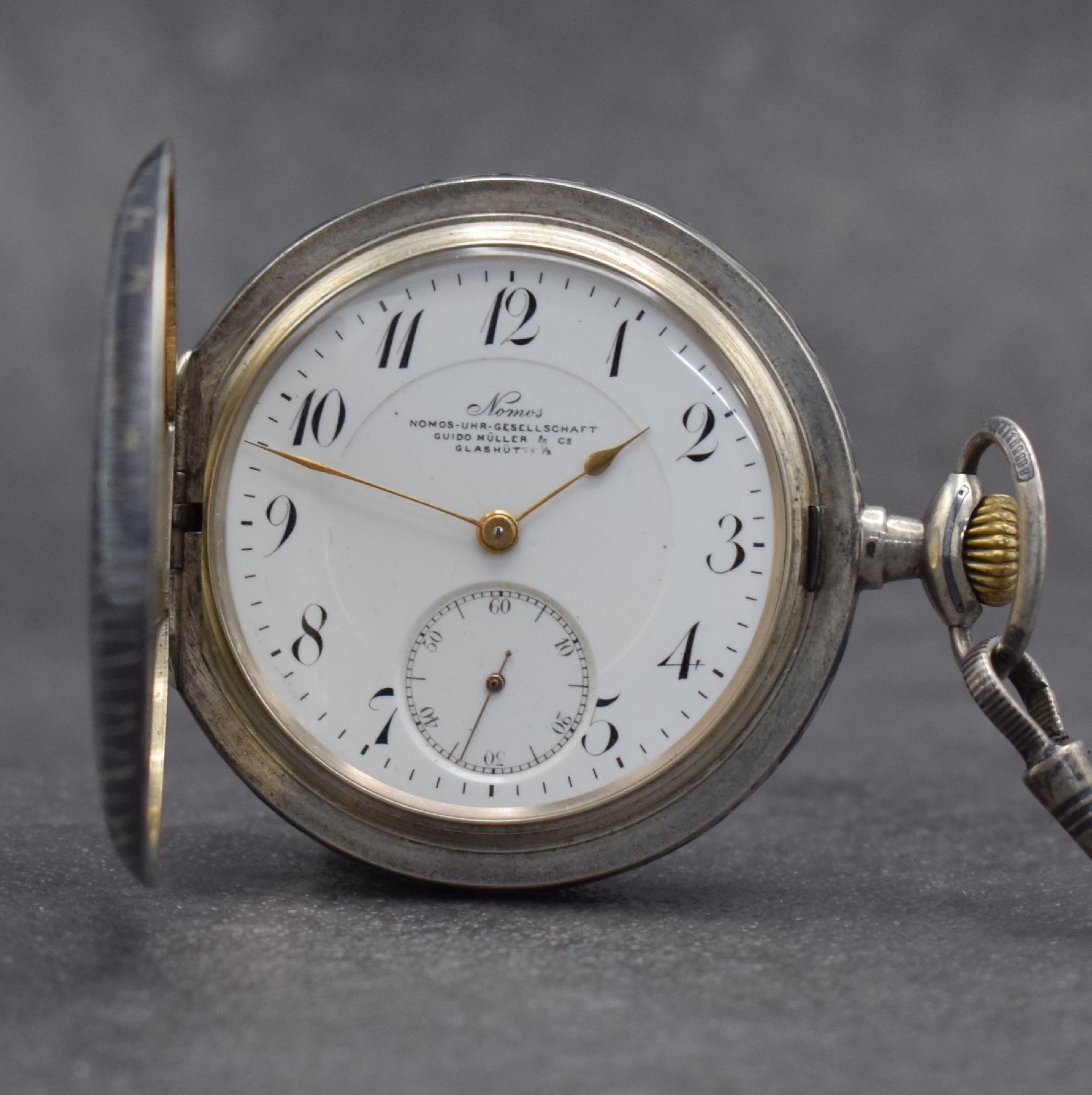 NOMOS Uhr-Gesellschaft Guido Müller & Co Glashütte I/S Savonette in Tula-Silber, Deutschland um 1905, aufw. verz. Gehäuse l. besch., 3-teil. ...