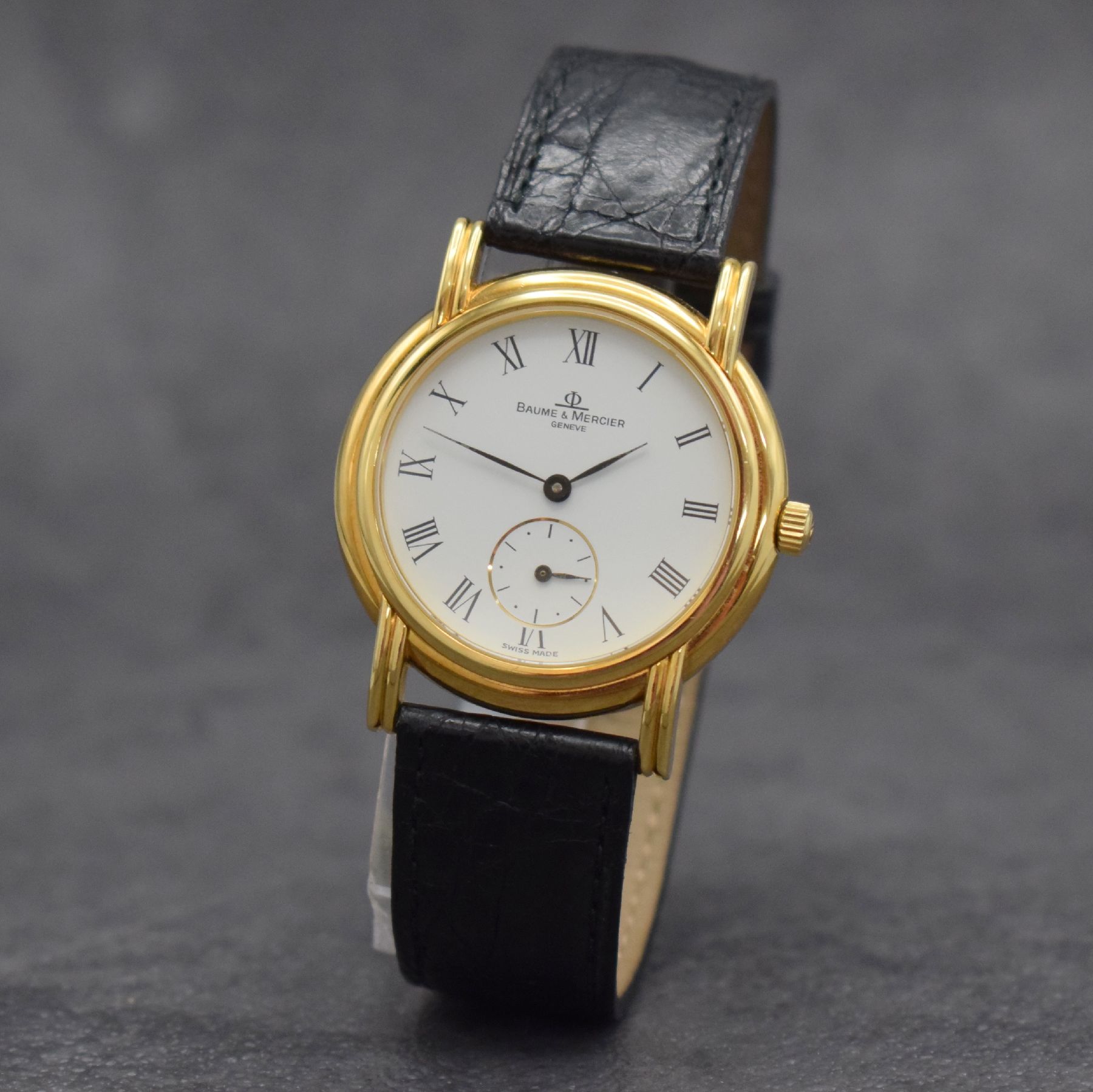 Detail b: BAUME & MERCIER Herrenarmbanduhr in GG 750/000, Schweiz um 1990, Handaufzug, Ref. 35100, 2-teil. Geh., Boden aufgedr., orig. Lederband m. verg. orig. ...