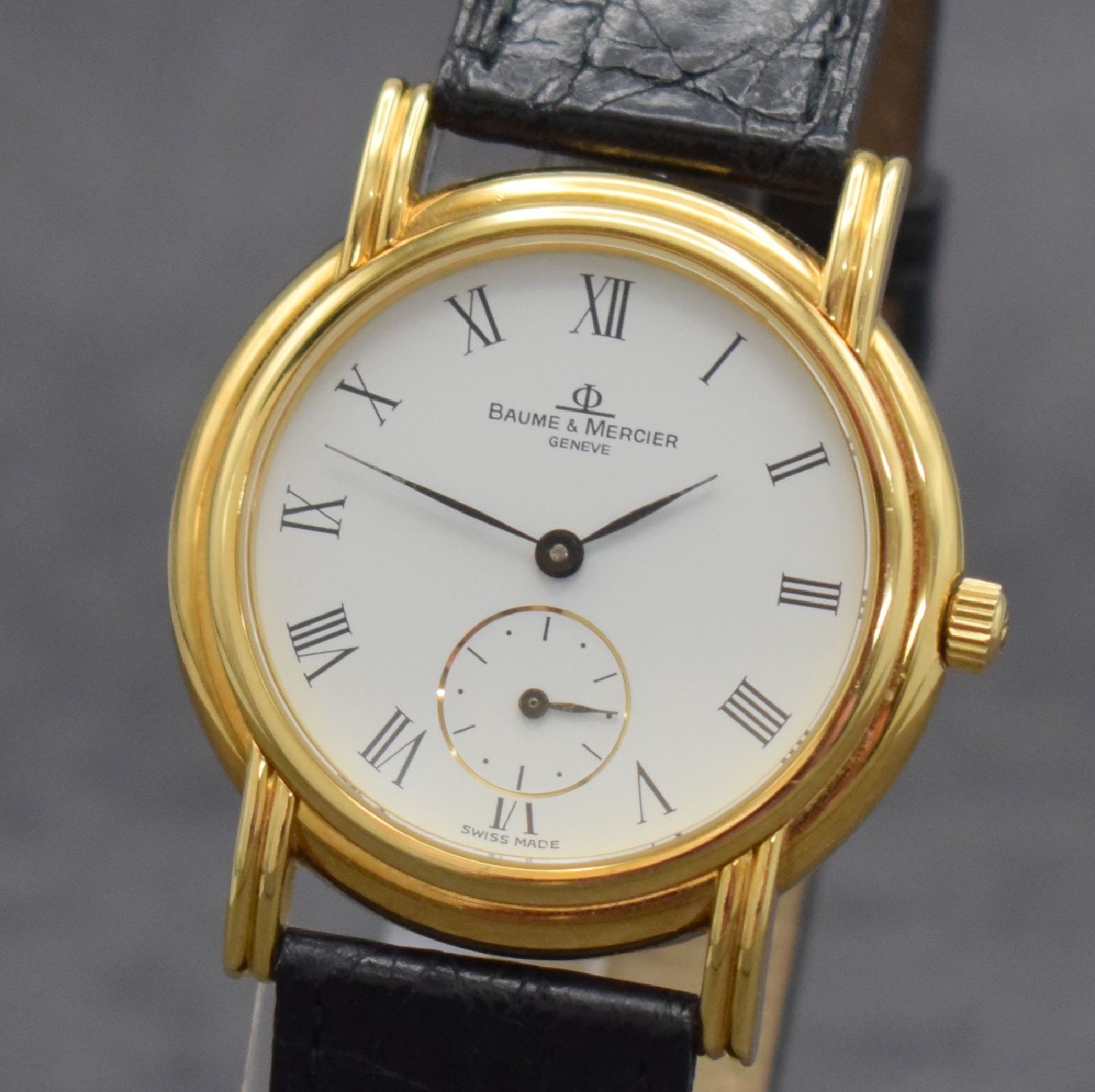 Detail c: BAUME & MERCIER Herrenarmbanduhr in GG 750/000, Schweiz um 1990, Handaufzug, Ref. 35100, 2-teil. Geh., Boden aufgedr., orig. Lederband m. verg. orig. ...