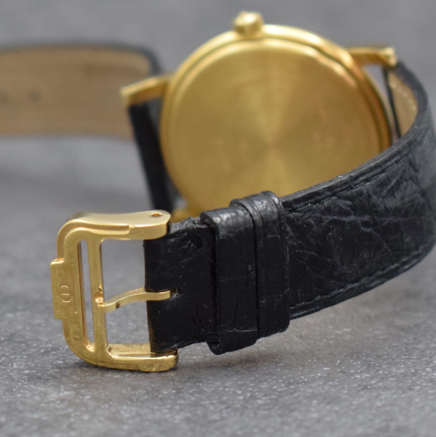 Detail g: BAUME & MERCIER Herrenarmbanduhr in GG 750/000, Schweiz um 1990, Handaufzug, Ref. 35100, 2-teil. Geh., Boden aufgedr., orig. Lederband m. verg. orig. ...