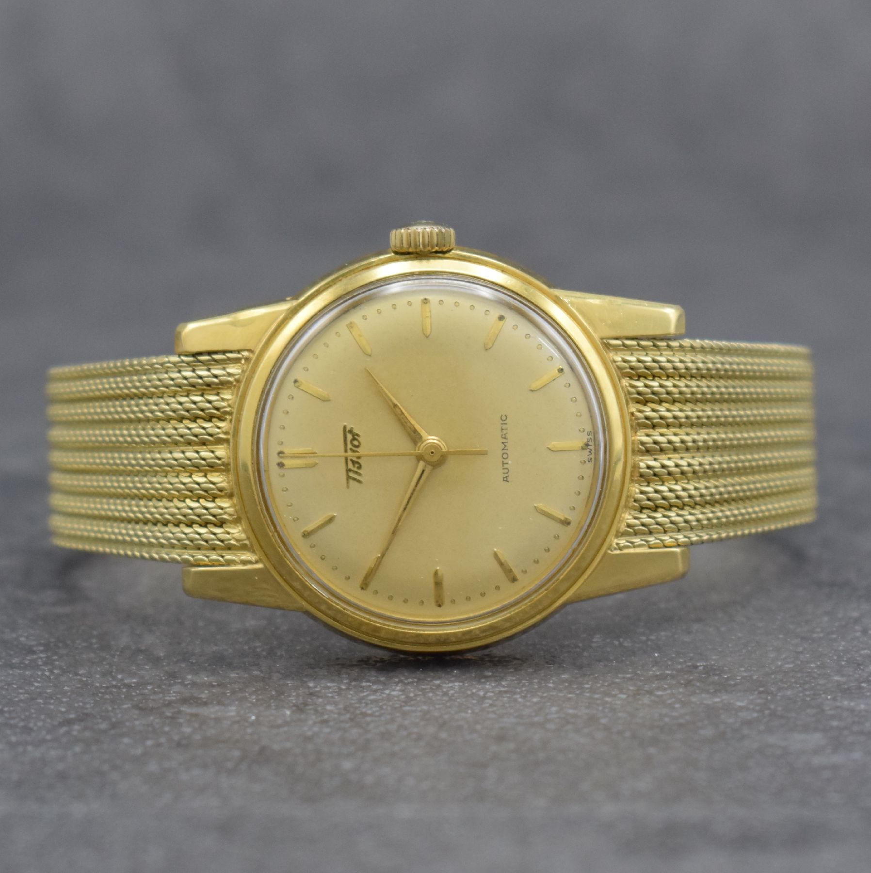 TISSOT Herrenarmbanduhr in GG 585/000 an original Milanaiseband, Automatik, Schweiz um 1960, verschr. Boden m. starken Rep.-Spuren, gold. Zifferbl. ...