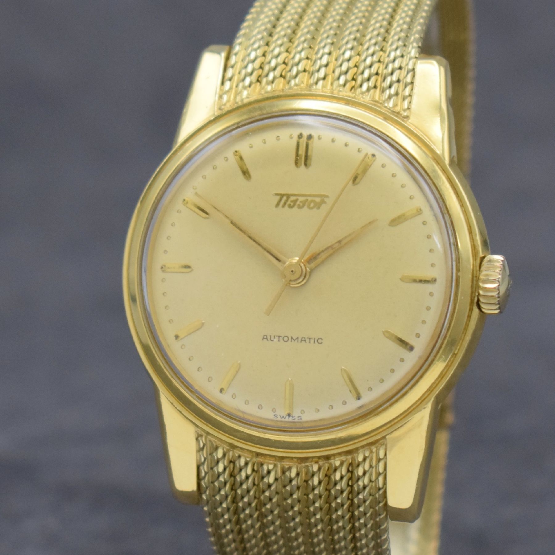 Detail c: TISSOT Herrenarmbanduhr in GG 585/000 an original Milanaiseband, Automatik, Schweiz um 1960, verschr. Boden m. starken Rep.-Spuren, gold. Zifferbl. ...