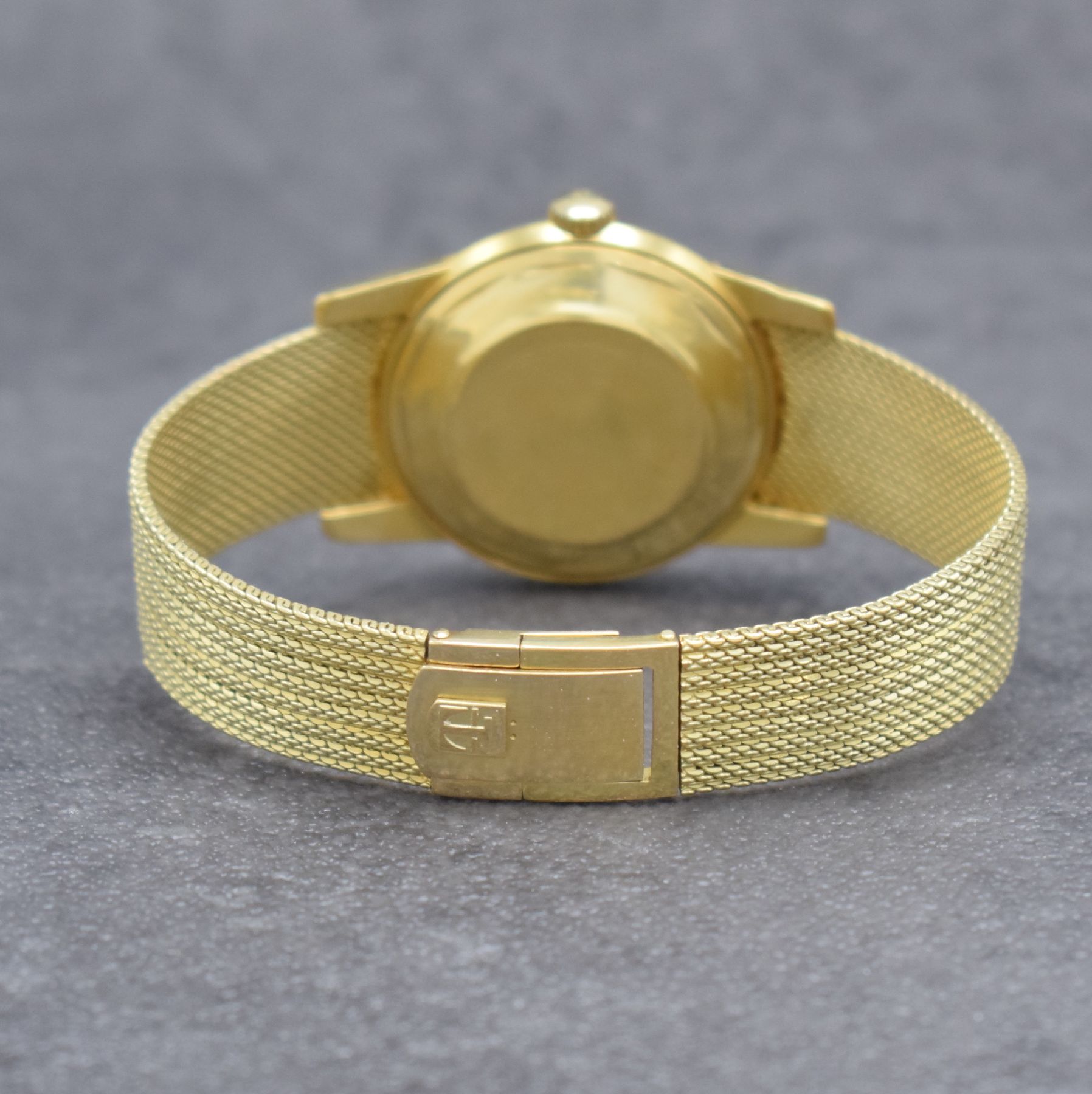 Detail f: TISSOT Herrenarmbanduhr in GG 585/000 an original Milanaiseband, Automatik, Schweiz um 1960, verschr. Boden m. starken Rep.-Spuren, gold. Zifferbl. ...
