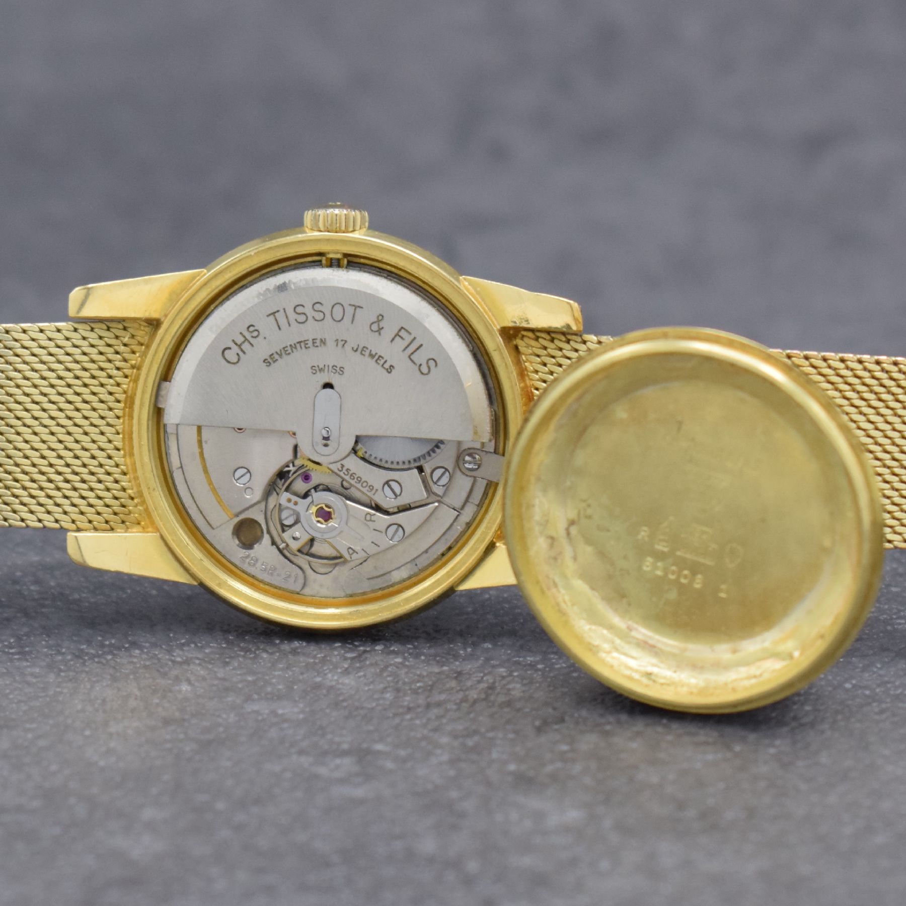 Detail h: TISSOT Herrenarmbanduhr in GG 585/000 an original Milanaiseband, Automatik, Schweiz um 1960, verschr. Boden m. starken Rep.-Spuren, gold. Zifferbl. ...