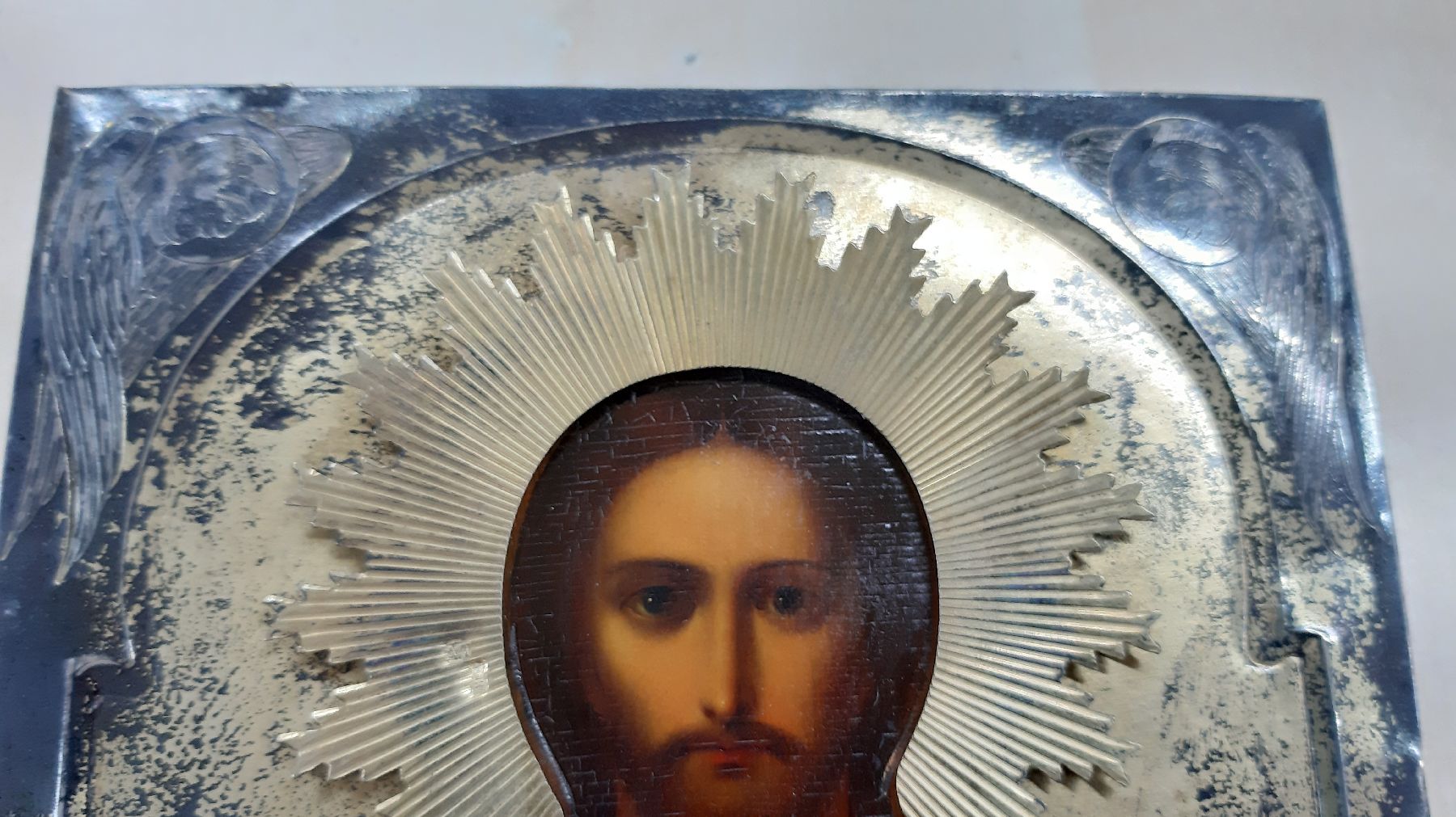 Detail e: Ikone Russland, um 1900, Silberoklad, Christus Pantokrator, Eitempera/Holz, 18 x 14 cm, Reste Vergoldung