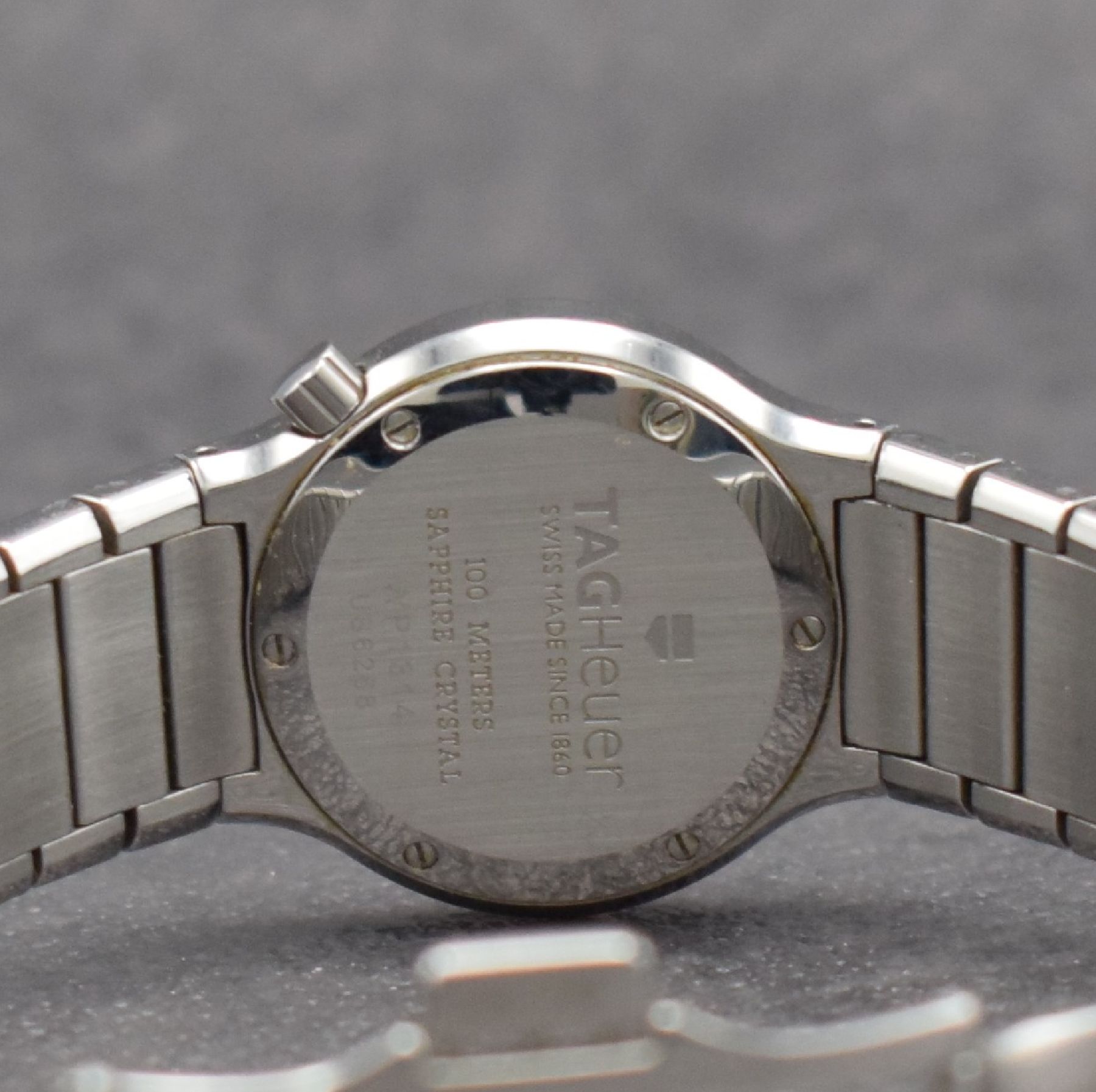 Detail e: TAG HEUER Alter Ego Damenuhr in Stahl/ Stahlband, Schweiz um 2000, quartz, pol. Geh. m. integriertem Band, Doppelfaltschl., Saphirglas, Boden 6-fach ...