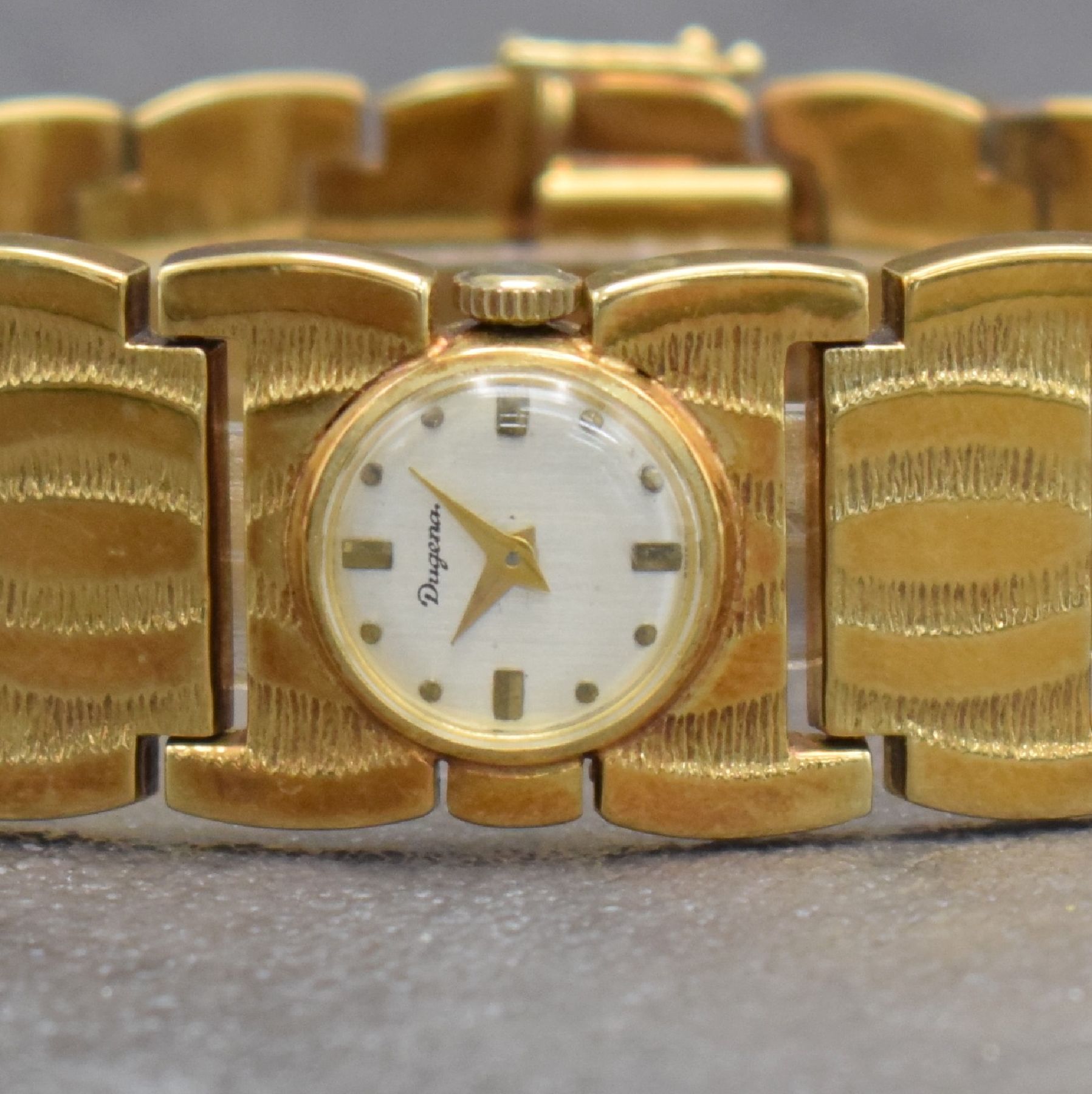 Detail a: DUGENA ausgefallene Damenarmbanduhr in GG 585/000, Handaufzug, Schweiz um 1970, Boden aufgedr., silb. Zifferbl. m. aufgel. Indizes altersbed. l. fl., ...