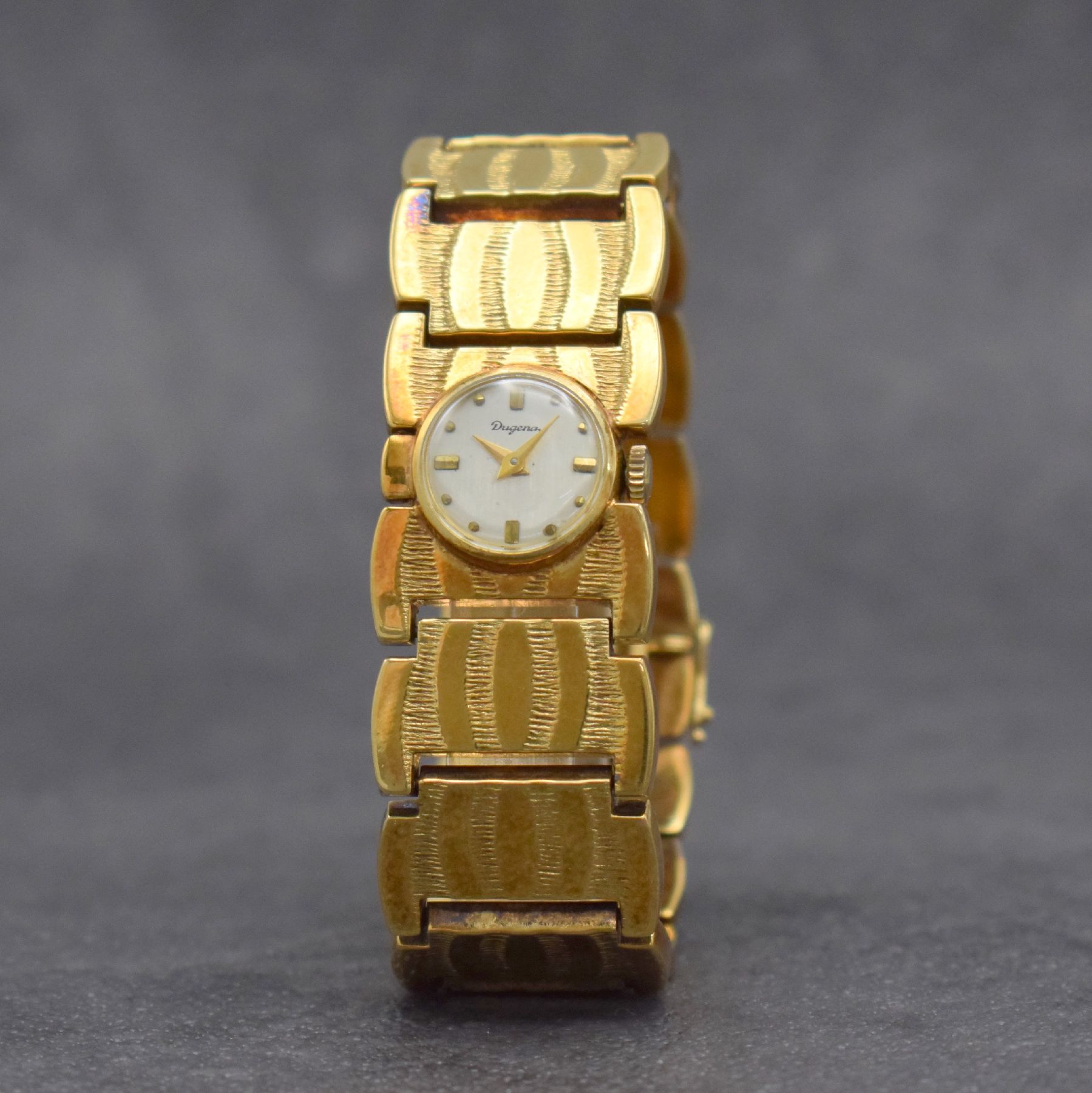 Detail b: DUGENA ausgefallene Damenarmbanduhr in GG 585/000, Handaufzug, Schweiz um 1970, Boden aufgedr., silb. Zifferbl. m. aufgel. Indizes altersbed. l. fl., ...