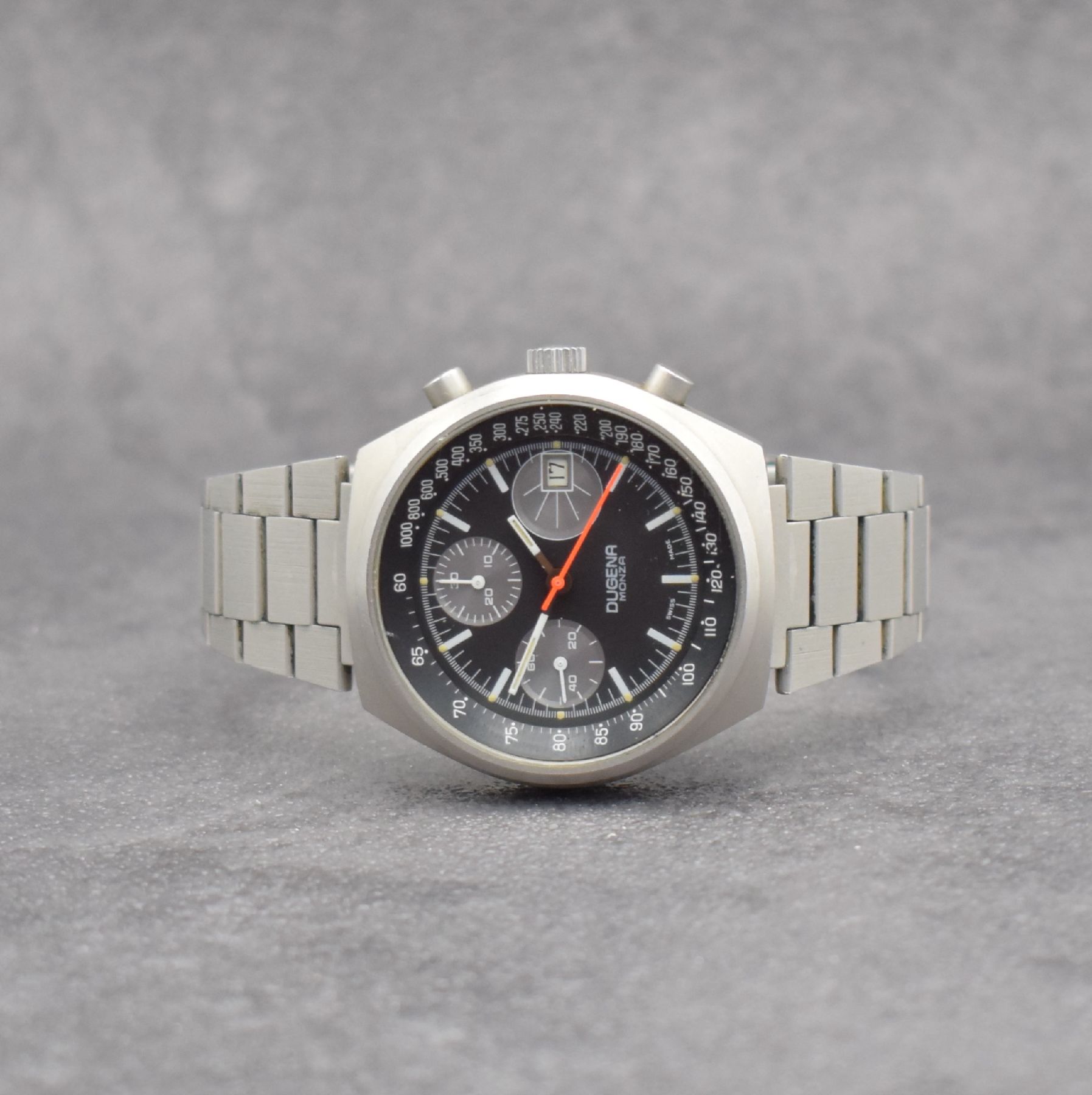 DUGENA Armbandchronograph Serie Monza, Handaufzug, Schweiz um 1970, matt. Edelstahlgeh. inkl. Gliederband m. Faltschl., verschr. Boden m. ...