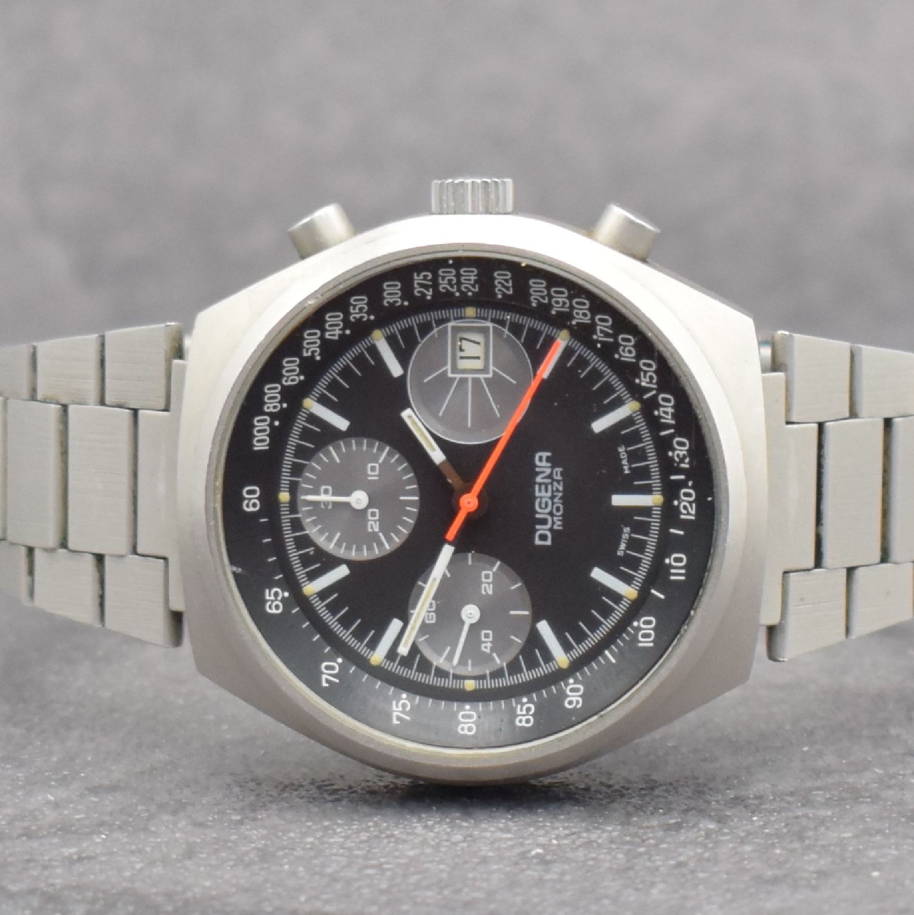 Detail a: DUGENA Armbandchronograph Serie Monza, Handaufzug, Schweiz um 1970, matt. Edelstahlgeh. inkl. Gliederband m. Faltschl., verschr. Boden m. ...