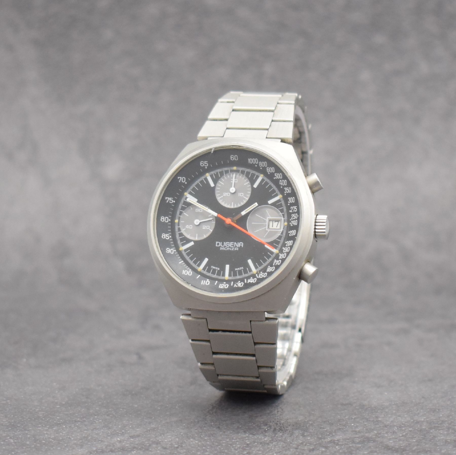 Detail b: DUGENA Armbandchronograph Serie Monza, Handaufzug, Schweiz um 1970, matt. Edelstahlgeh. inkl. Gliederband m. Faltschl., verschr. Boden m. ...