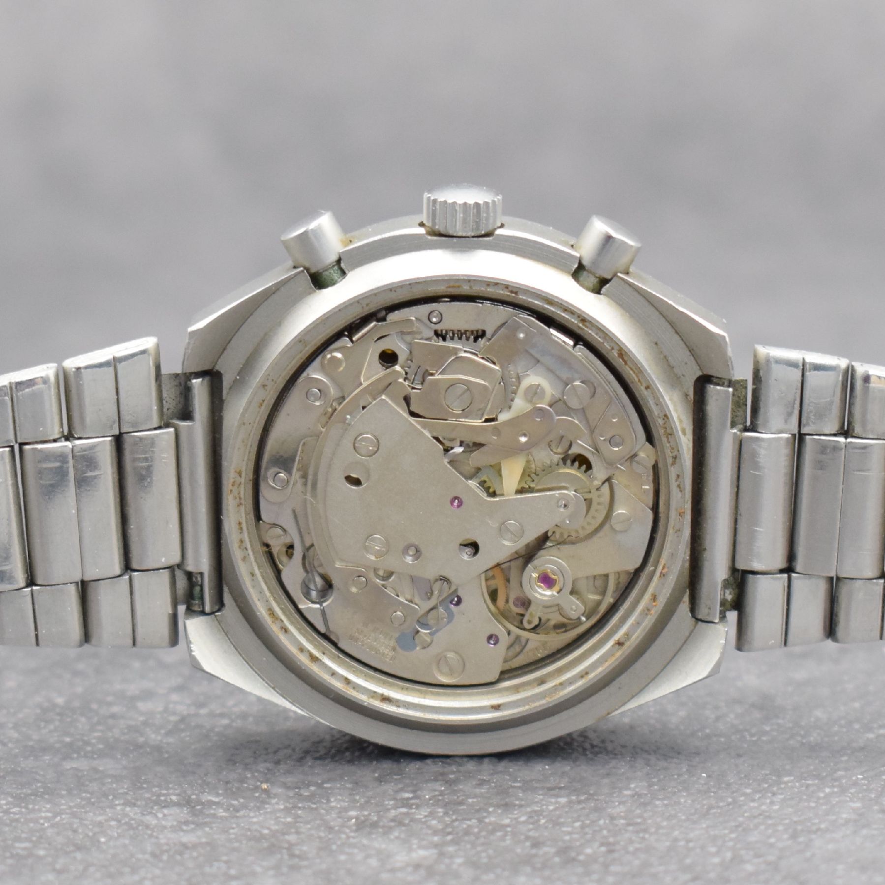 Detail e: DUGENA Armbandchronograph Serie Monza, Handaufzug, Schweiz um 1970, matt. Edelstahlgeh. inkl. Gliederband m. Faltschl., verschr. Boden m. ...