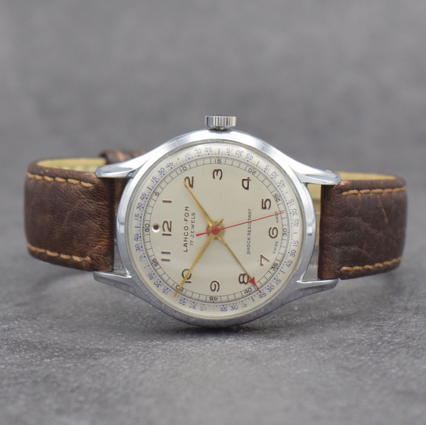 LANCO-FON Herrenarmbanduhr mit Weckfunktion,Schweiz um 1950, Handaufzug, verchr. Gehäuse, Edelstahlboden aufgedr., vers. Zifferbl. m. gold. arab. ...