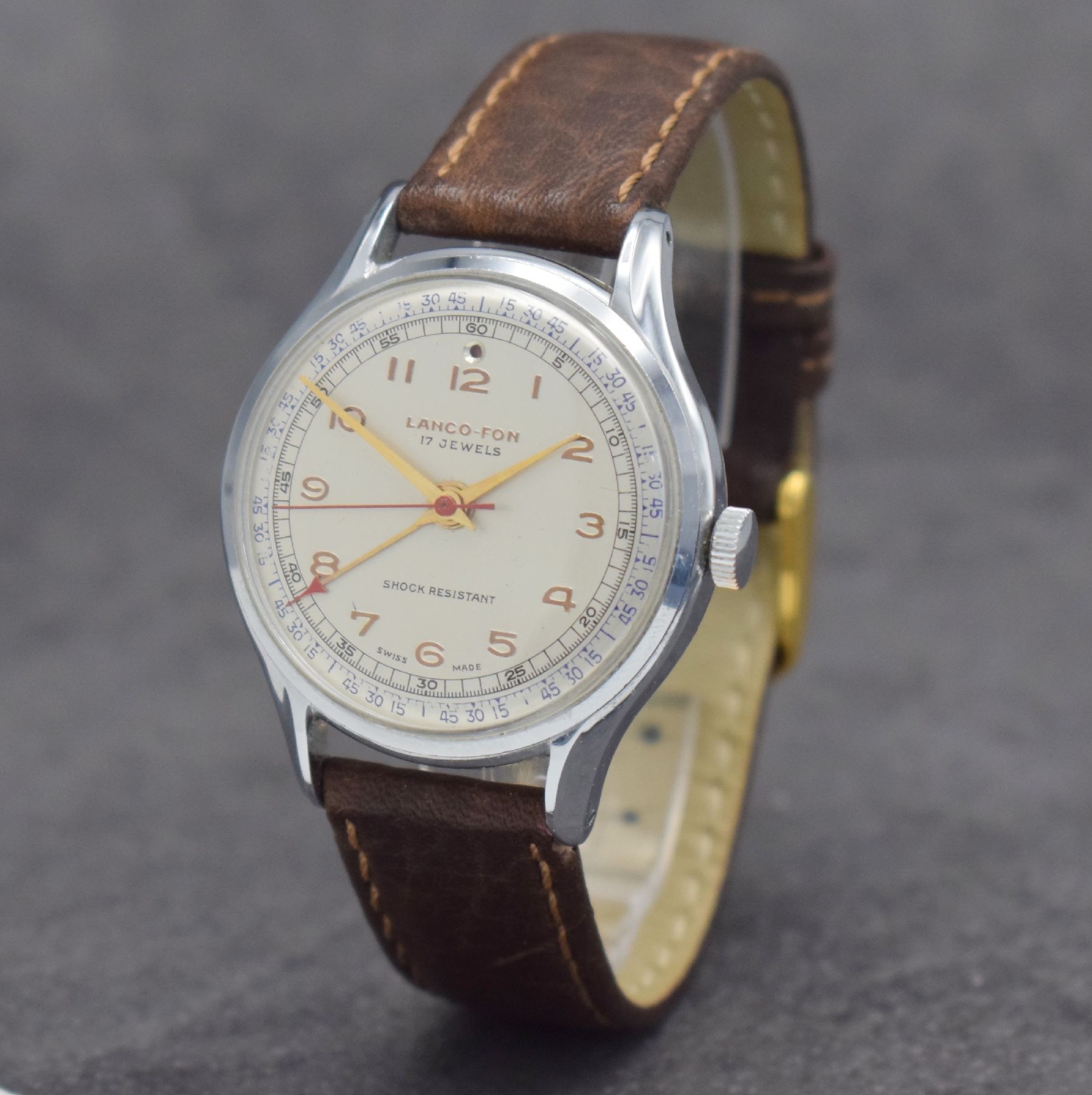 Detail b: LANCO-FON Herrenarmbanduhr mit Weckfunktion,Schweiz um 1950, Handaufzug, verchr. Gehäuse, Edelstahlboden aufgedr., vers. Zifferbl. m. gold. arab. ...