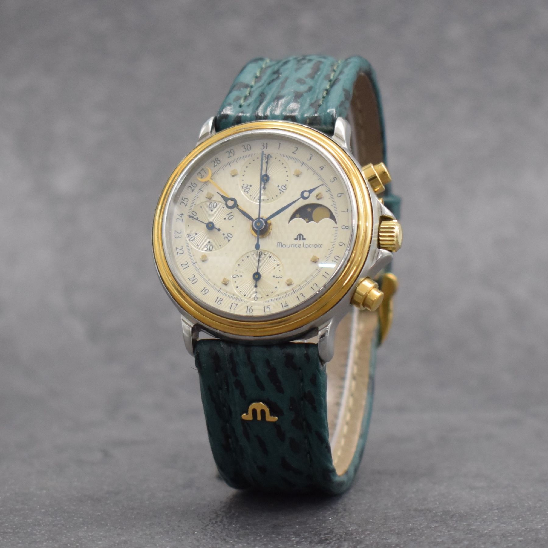 Detail b: MAURICE LACROIX Herrenarmbanduhr mit Chronograph & Mondphase, Schweiz um 1990, Automatik, Ref. 01939, Stahl/Gold komb., verschr. Boden (besch.) & ...