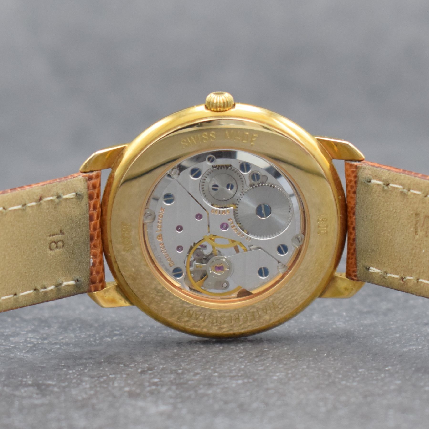 Detail d: MAURICE LACROIX Herrenarmbanduhr, Schweiz um 1995, Handaufzug, Ref. 38355, verg. Geh. beids. vergl., Boden aufgedr., Maurice Lacroix Lederband m. ...