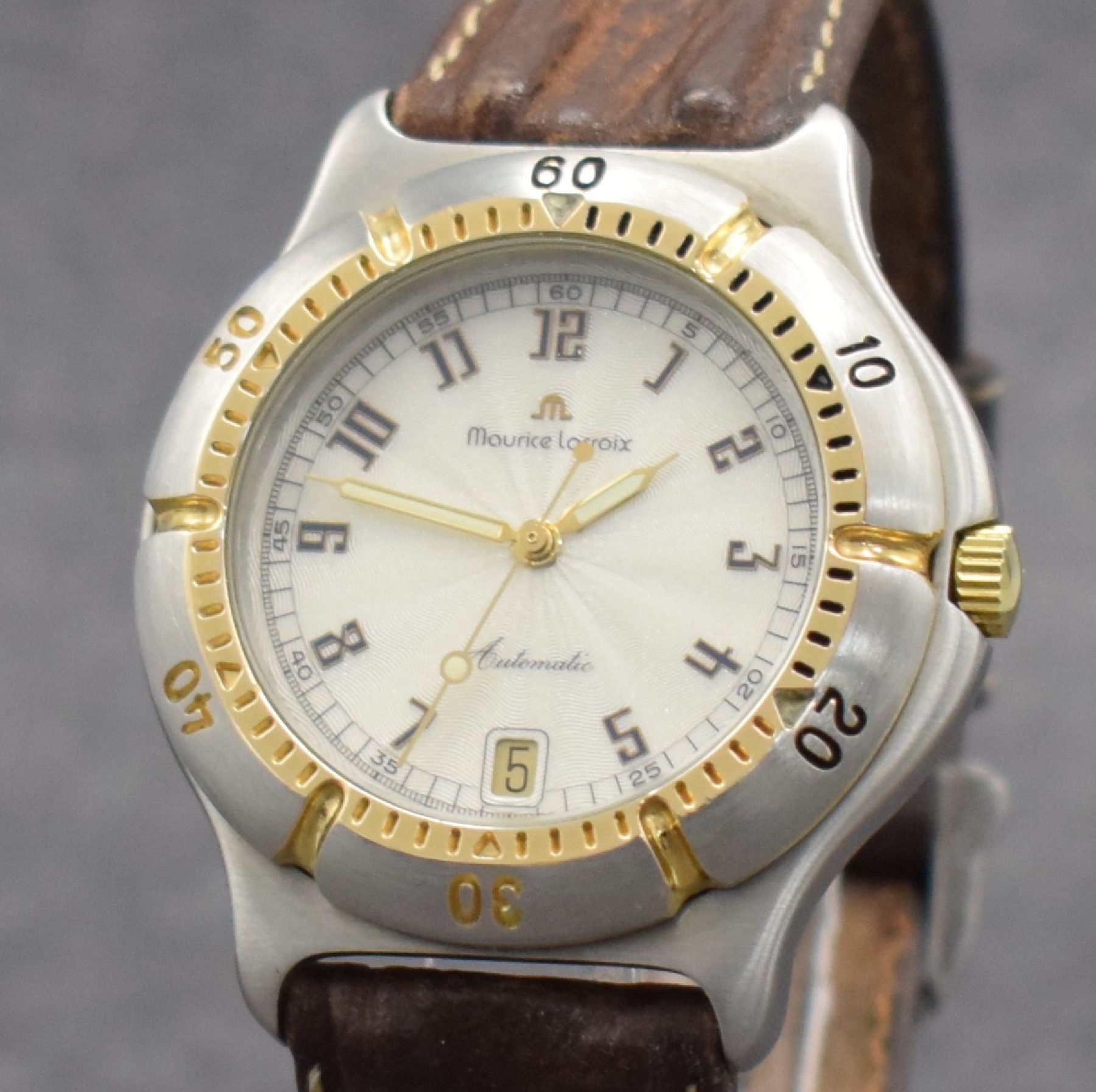Detail c: MAURICE LACROIX Diver Herrenarmbanduhr, Schweiz um 1995, Automatik, Ref. 23267, Geh. in Stahl/Gold, Boden verschr., Maurice Lacroix Lederband m. ...