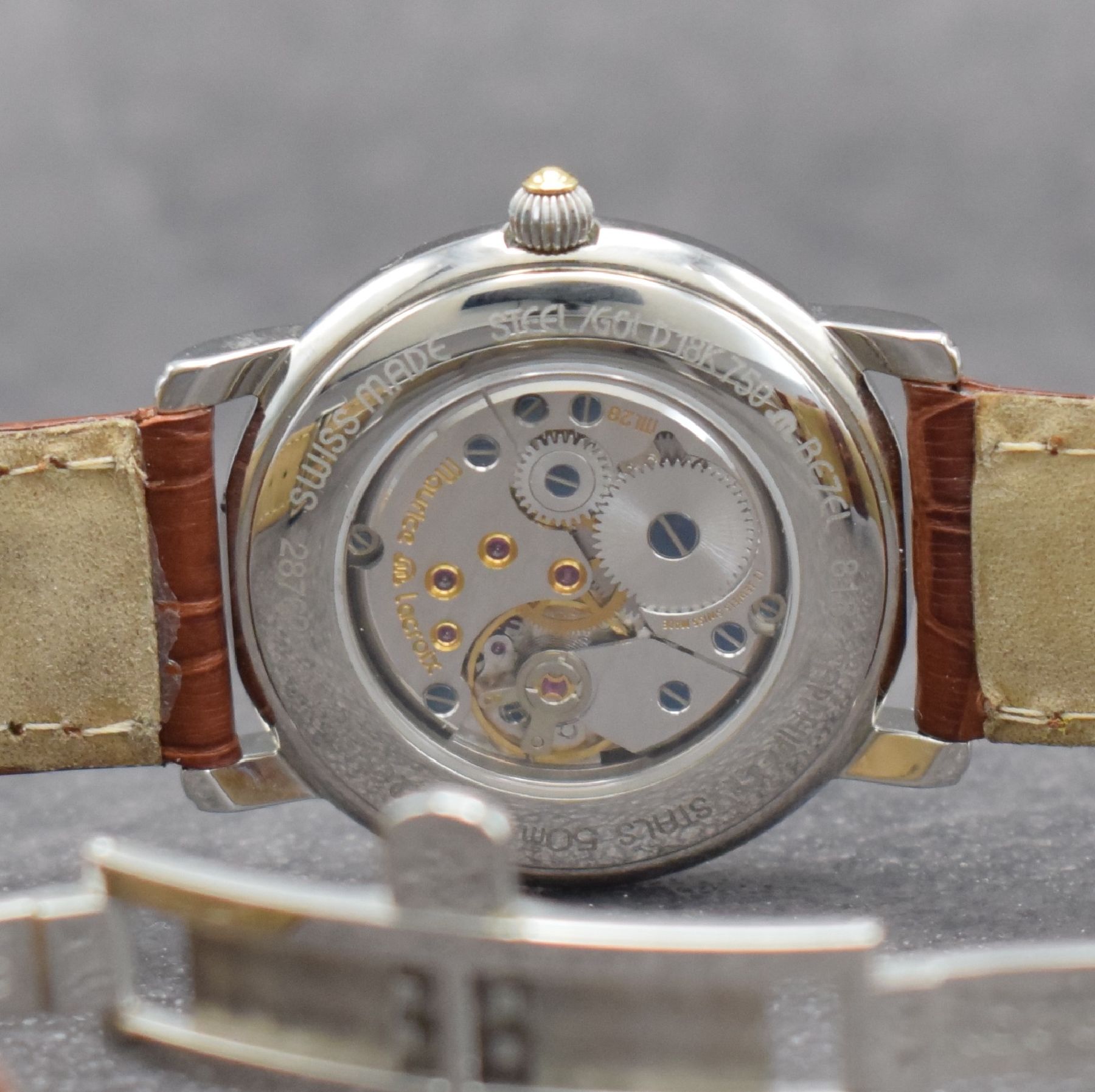 Detail d: MAURICE LACROIX Masterpiece Heure Sautante Herrenarmbanduhr, Schweiz um 2005, Handaufzug, beids. vergl. Edelstahlgeh., Boden aufgedr., Maurice ...