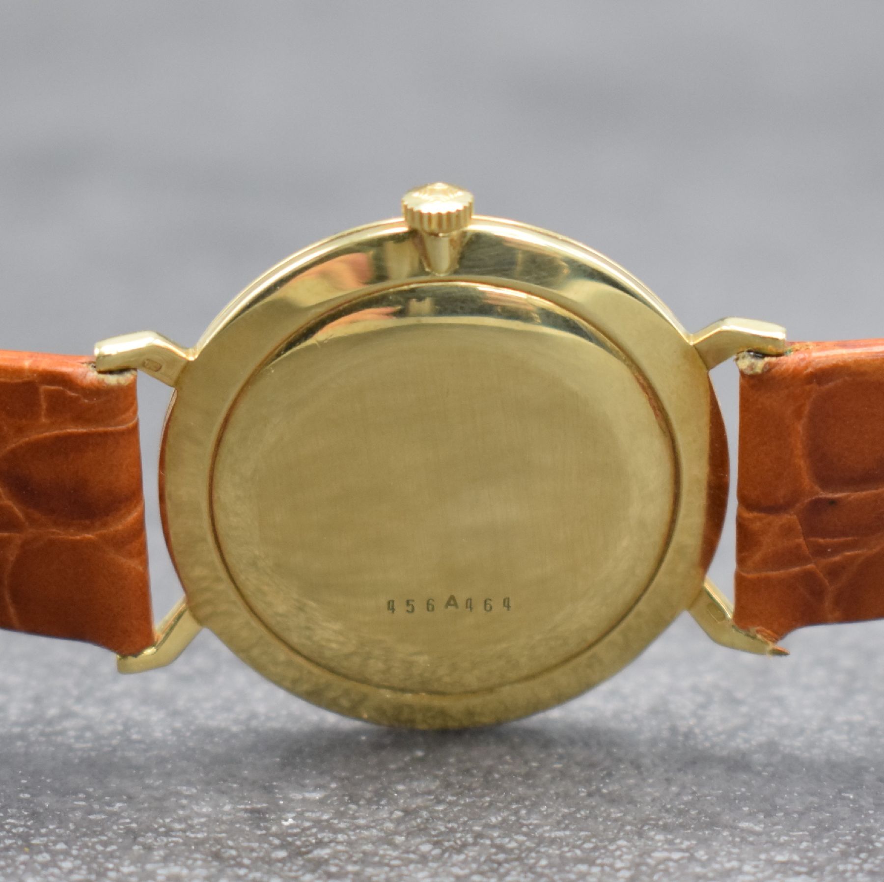 Detail e: ZENITH Herrenarmbanduhr in GG 750/000, Handaufzug, Schweiz um 1982, Boden & Glasrand aufgedr., vers. Zifferbl. m. aufgel. Indizes l. fl., Anz. v. ...