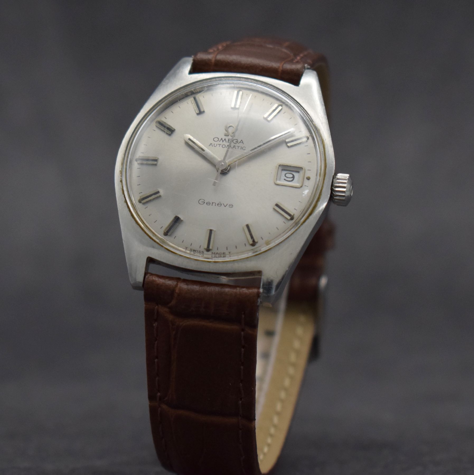 Detail b: OMEGA Geneve Herrenarmbanduhr, Schweiz um 1968, Automatik, Ref. 166.041, Edelstahlgeh., Boden geschr., Omega Krone, vers. Zifferbl. m. aufges. ...