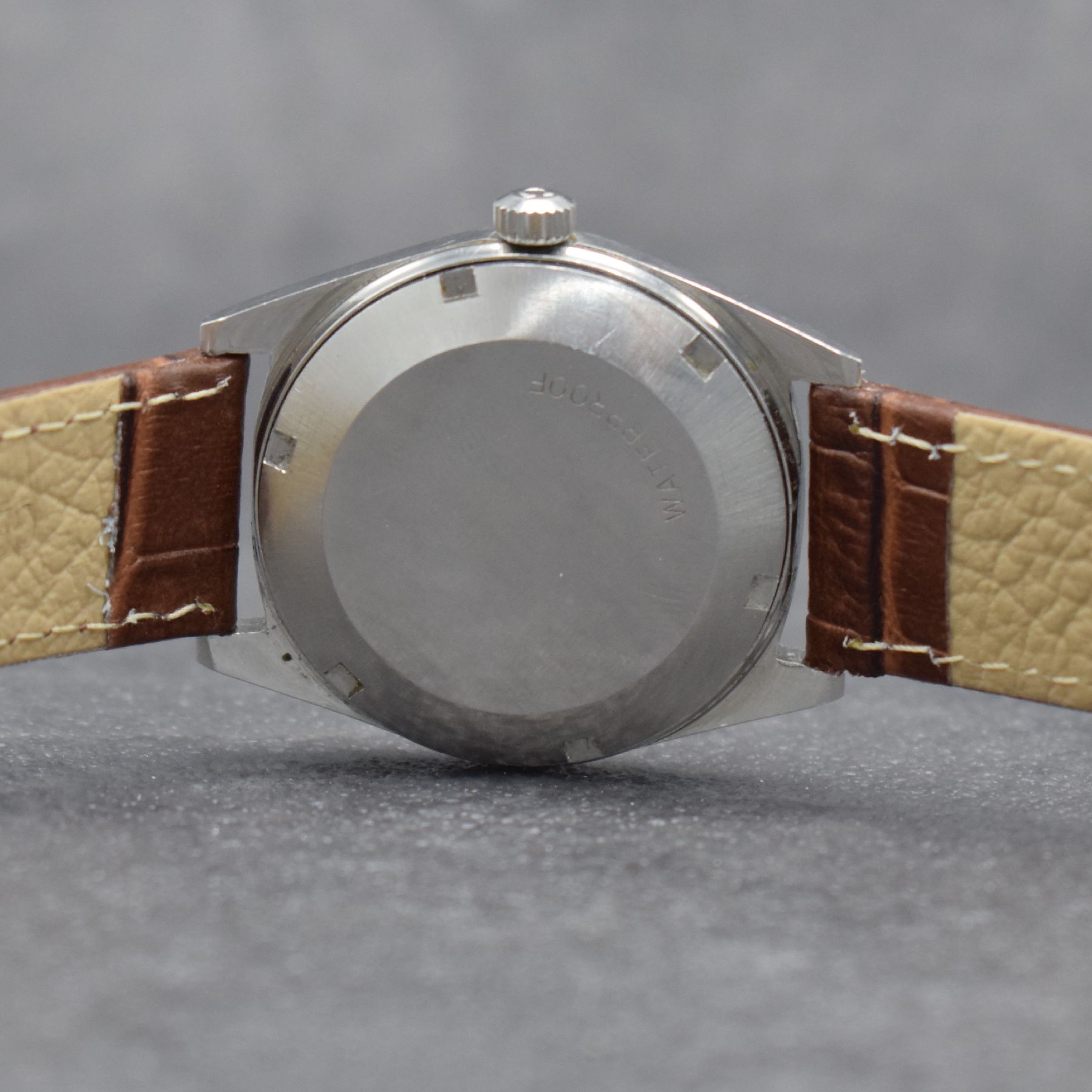 Detail e: OMEGA Geneve Herrenarmbanduhr, Schweiz um 1968, Automatik, Ref. 166.041, Edelstahlgeh., Boden geschr., Omega Krone, vers. Zifferbl. m. aufges. ...