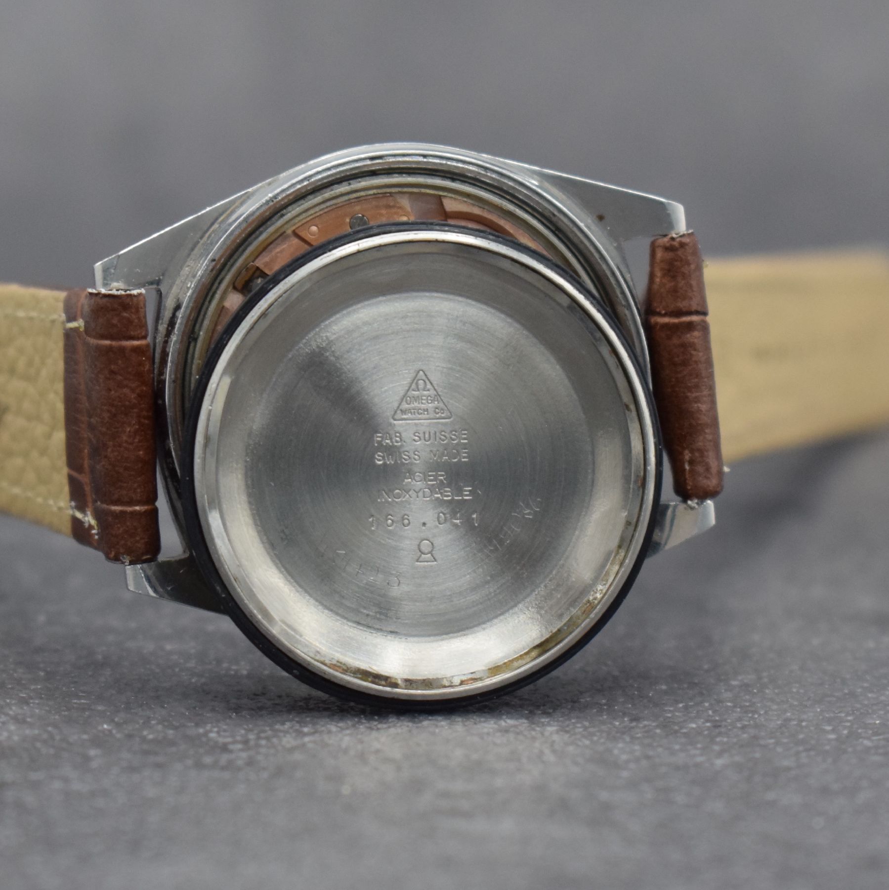 Detail g: OMEGA Geneve Herrenarmbanduhr, Schweiz um 1968, Automatik, Ref. 166.041, Edelstahlgeh., Boden geschr., Omega Krone, vers. Zifferbl. m. aufges. ...