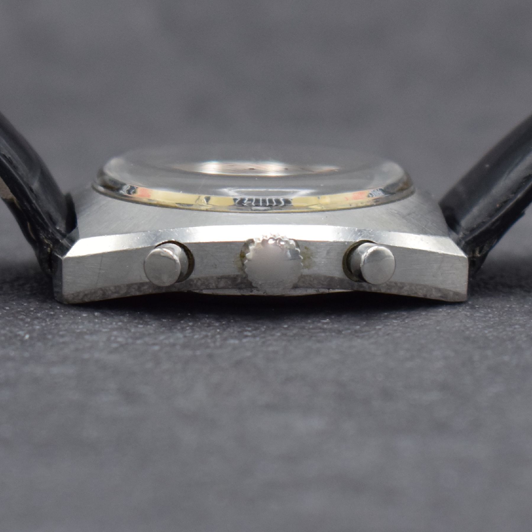Detail c: DUGENA Herrenarmbanduhr mit Chronograph, Schweiz um 1970, Handaufzug, massives Edelstahlgeh. m. geschr. Boden, silb. Zifferbl. m. aufges. Std.-Ind., ...