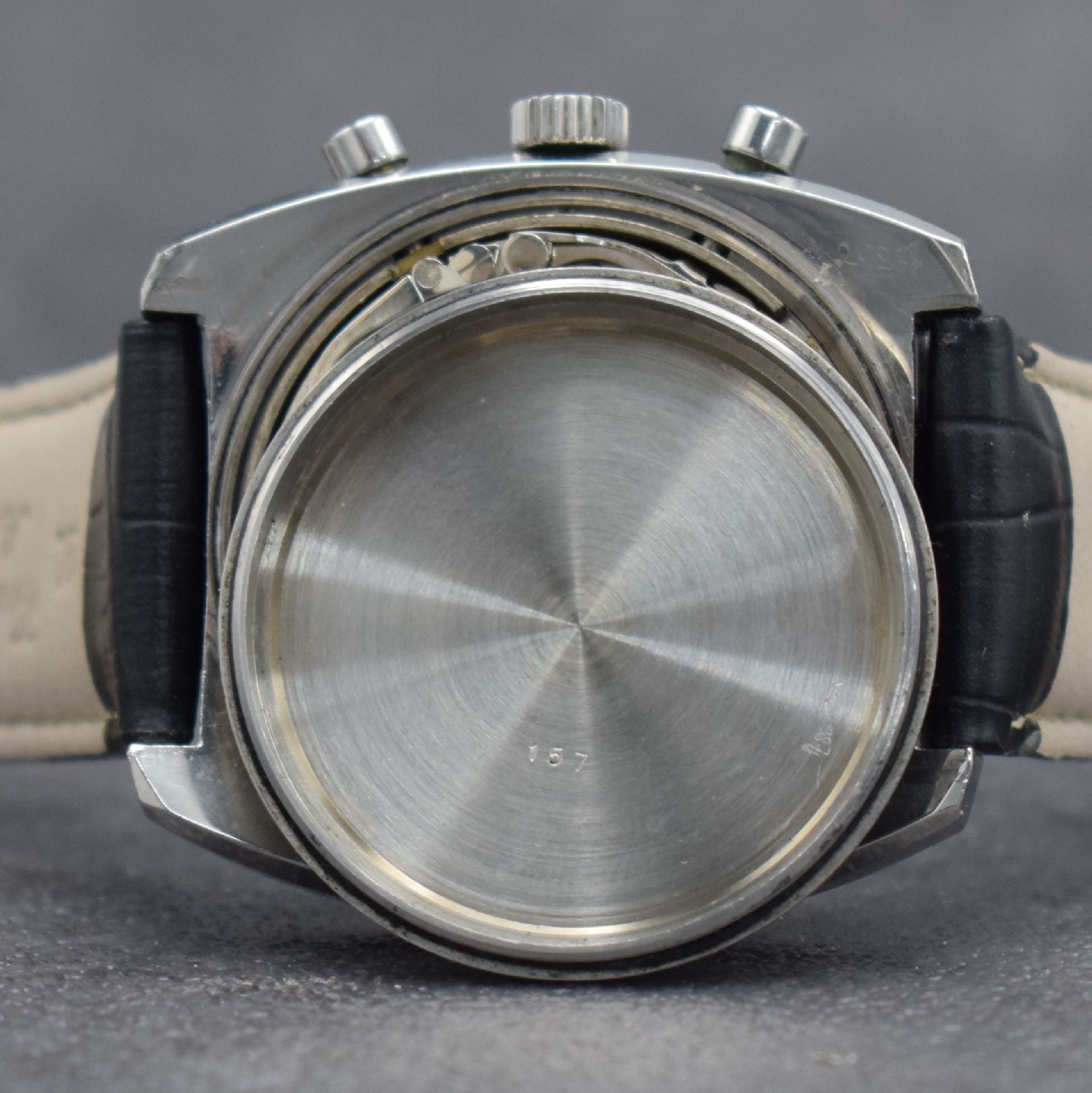 Detail g: DUGENA Herrenarmbanduhr mit Chronograph, Schweiz um 1970, Handaufzug, massives Edelstahlgeh. m. geschr. Boden, silb. Zifferbl. m. aufges. Std.-Ind., ...