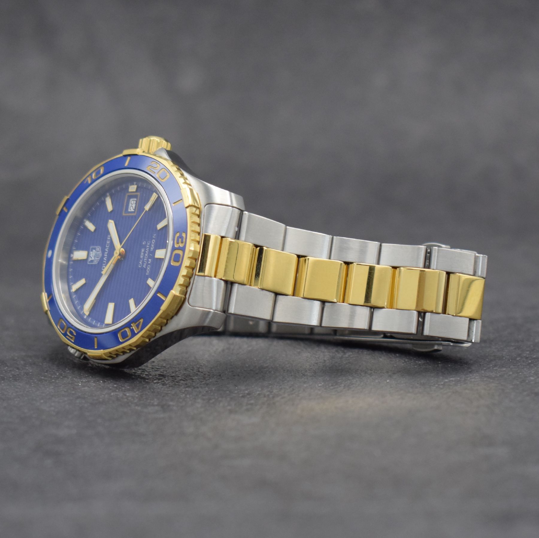 Detail d: TAG HEUER Herrenarmbanduhr Aquaracer Calibre 5, Automatik, Ref. WAK2120, Edelstahlgeh. inkl. Gliederband m. Faltschl. z. T. verg., Boden & Krone ...