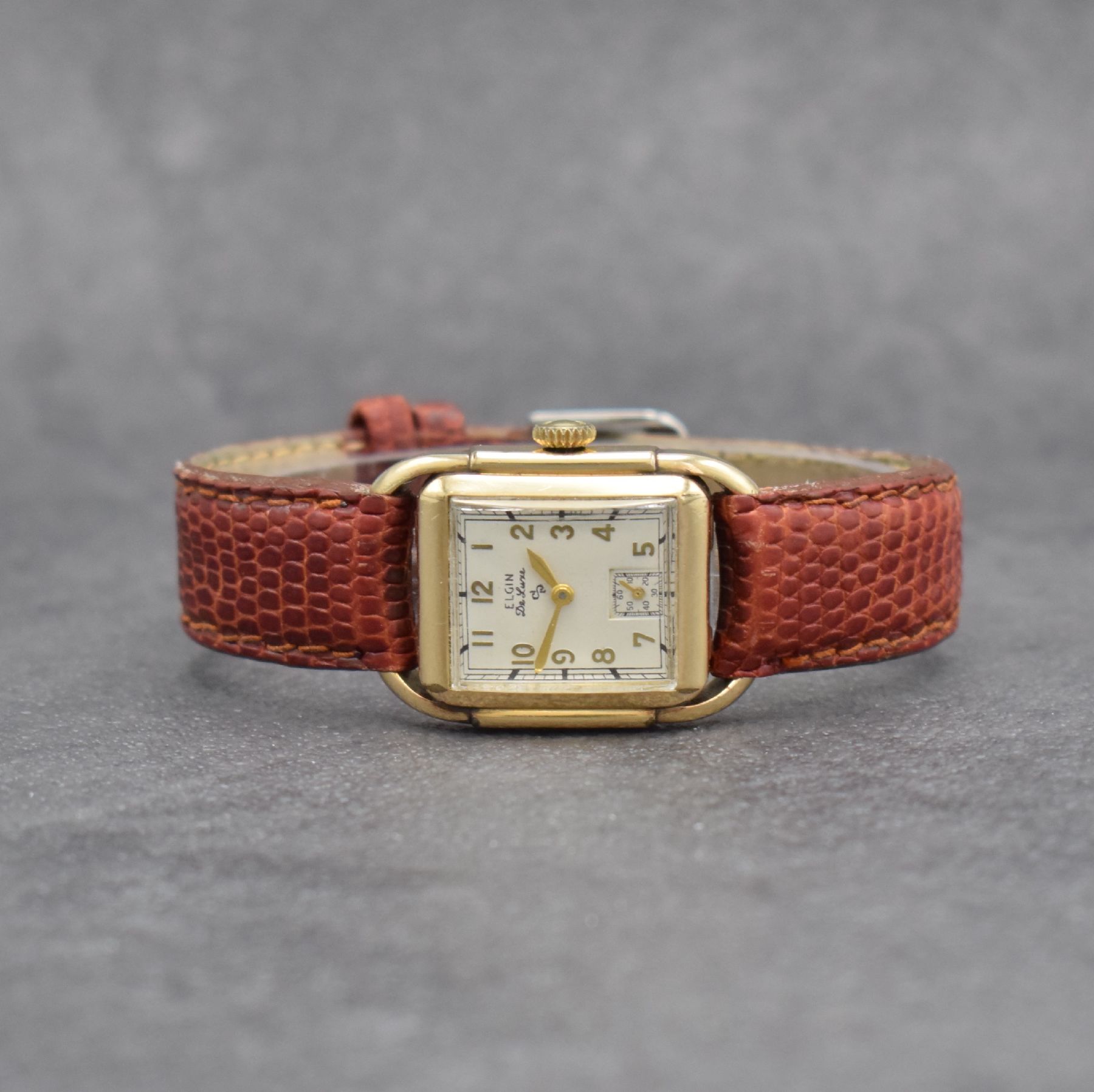 ELGIN De Luxe Armbanduhr, Handaufzug, USA 1940er Jahre, 10k Gold-Filled Geh., Boden m. Widmungsgravur aufgedr., weißes Zifferbl. m. arab. Std. ...