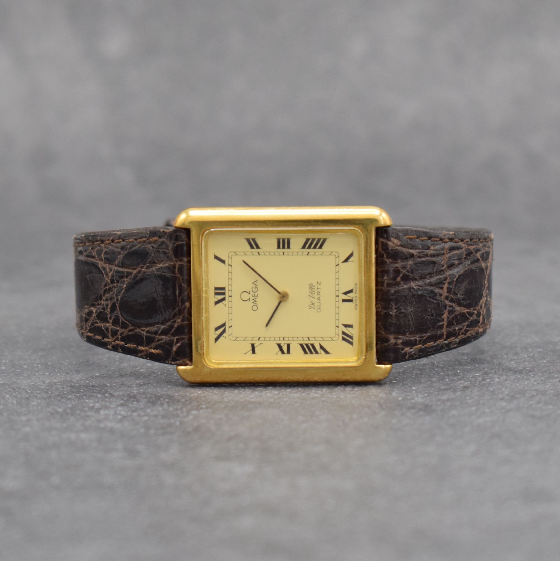 OMEGA De Ville Ref. 191 0055 rechteckige Armbanduhr in GG 750/000, Schweiz um 1978, quarz, gedr. Geh., Zeigerstellung über Drücker b. 3, orig. ...