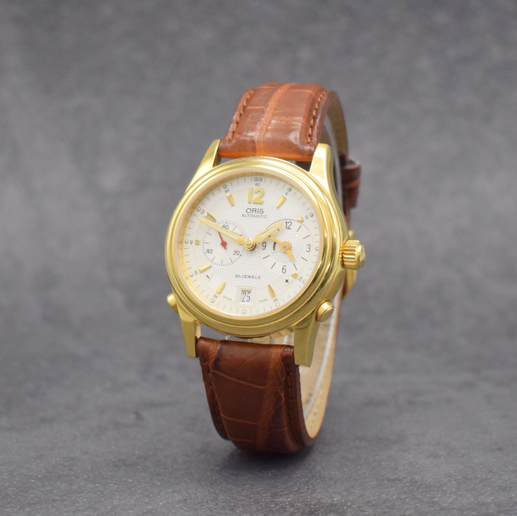 Detail b: ORIS Herrenarmbanduhr mit zweiter Zeitzone, Schweiz um 2000, Automatik, vergold. Stahlgeh. Ref. 7485, beids. Saphirvergl., Boden & Krone verschr., ...